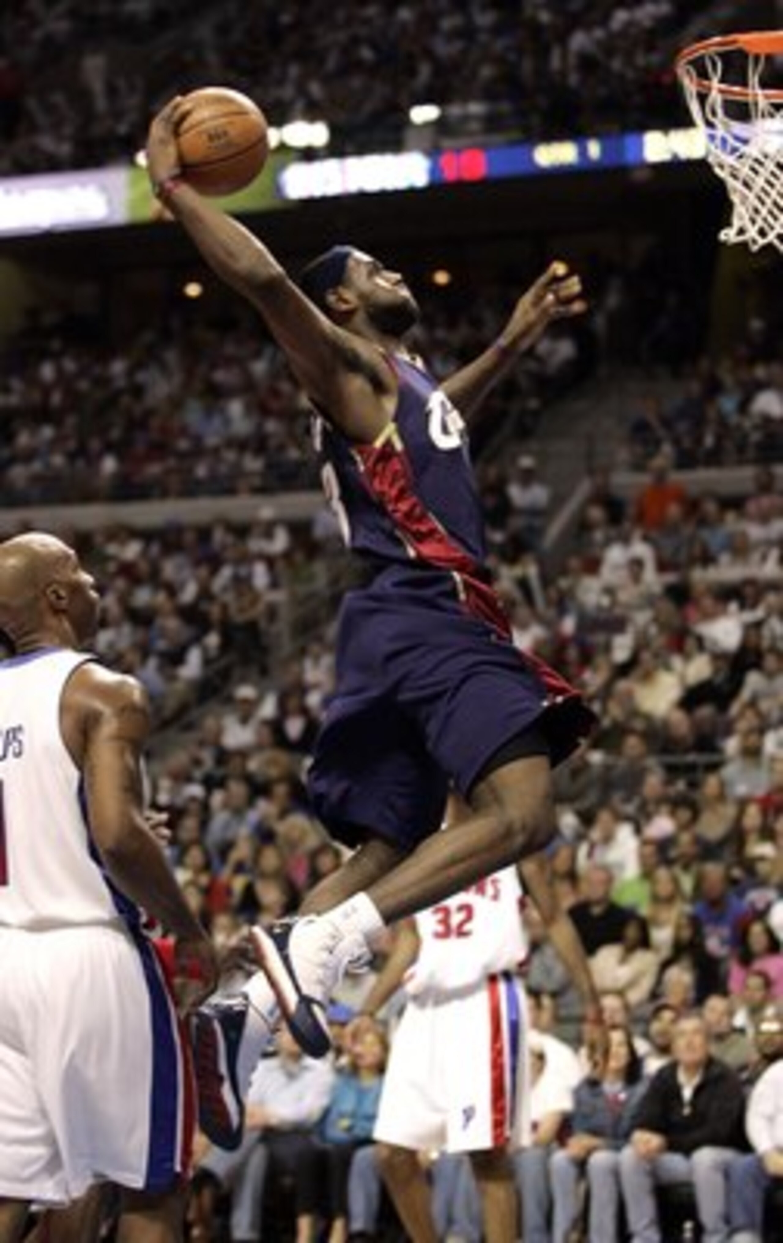 AUBURN HILLS, MI - MAY 21:  LeBron James #23 of the Cleveland Cavaliers gets in for a dunk between Chauncey Billups #1 and Richard Hamilton #32 of the Detroit Pistons in game seven of the Eastern Conference Semifinals during the 2006 NBA Playoffs on May 2