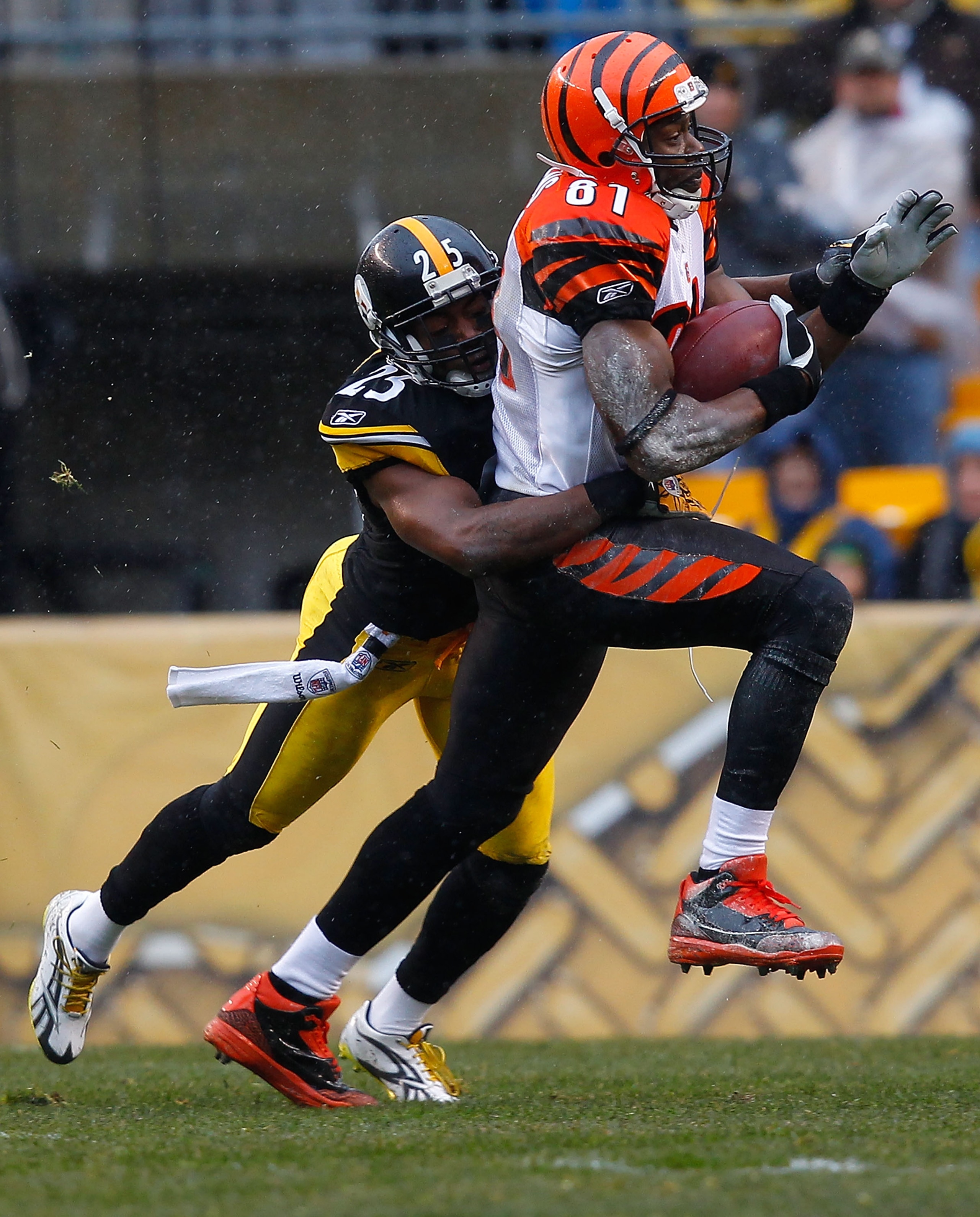 PITTSBURGH - DECEMBER 12:  Terell Owens #81 of the Cincinnati Bengals catches a pass in front of Ryan Clark #25 of the Pittsburgh Steelers during the game on December 12, 2010 at Heinz Field in Pittsburgh, Pennsylvania.  (Photo by Jared Wickerham/Getty Im