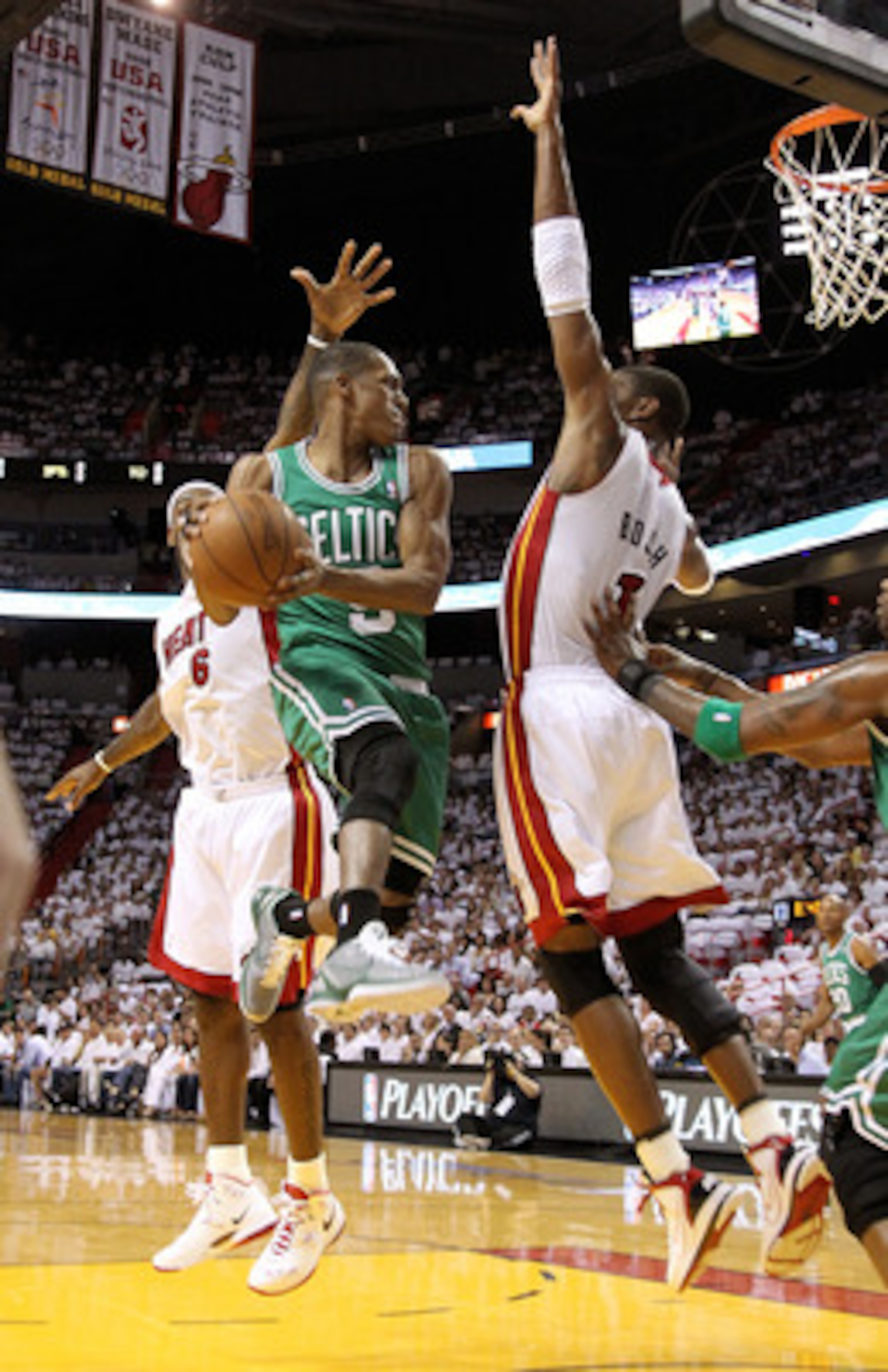 MIAMI, FL - MAY 03: Rajon Rondo #9 of the Boston Celtics takes a shot against Chris Bosh #1 and LeBron James #6 of the Miami Heat during Game Two of the Eastern Conference Semifinals of the 2011 NBA Playoffs at American Airlines Arena on May 3, 2011 in MIAMI, FL - MAY 03: Rajon Rondo #9 of the Boston Celtics takes a shot against Chris Bosh #1 and LeBron James #6 of the Miami Heat during Game Two of the Eastern Conference Semifinals of the 2011 NBA Playoffs at American Airlines Arena on May 3, 2011 in