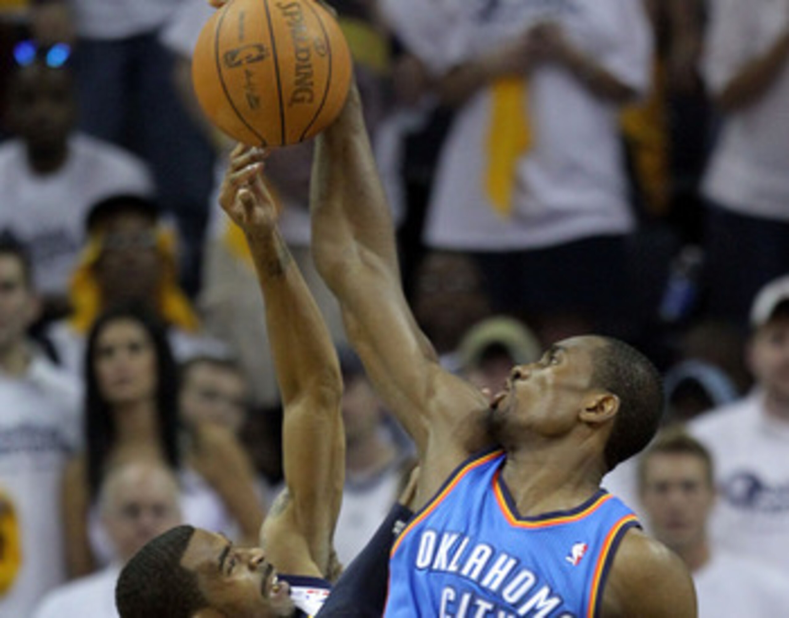 MEMPHIS, TN - MAY 07:  Serge Ibaka #9 of the Oklahoma City Thunder blocks the shot of Mike Conley #11 of the Memphis Grizzlies in Game Three of the Western Conference Semifinals in the 2011 NBA Playoffs at FedExForum on May 7, 2011 in Memphis, Tennessee.