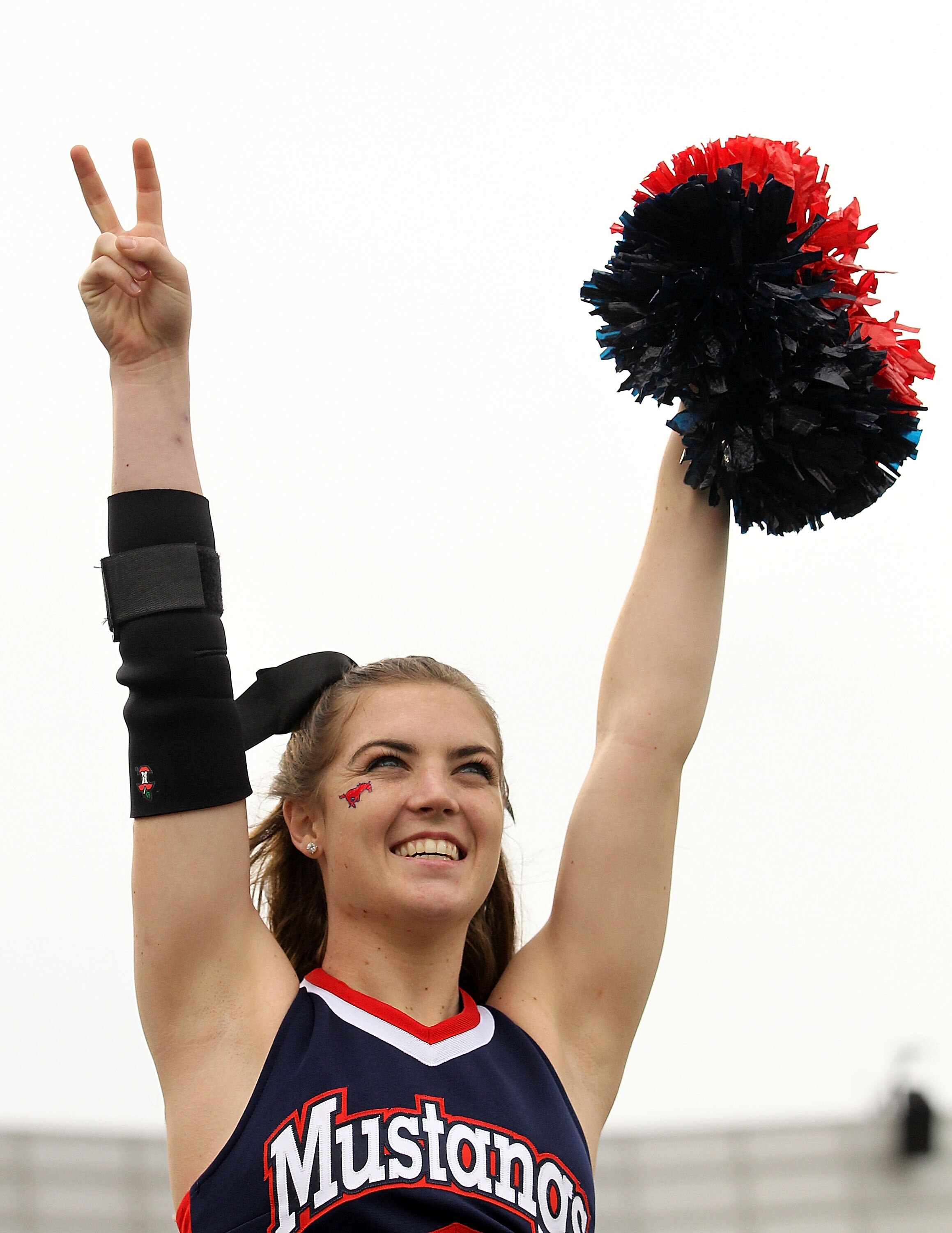 DALLAS, TX - DECEMBER 30:  A SMU Mustangs cheerleader during the Bell Helicopter Armed Forces Bowl at Gerald J. Ford Stadium on December 30, 2010 in Dallas, Texas.  (Photo by Ronald Martinez/Getty Images)