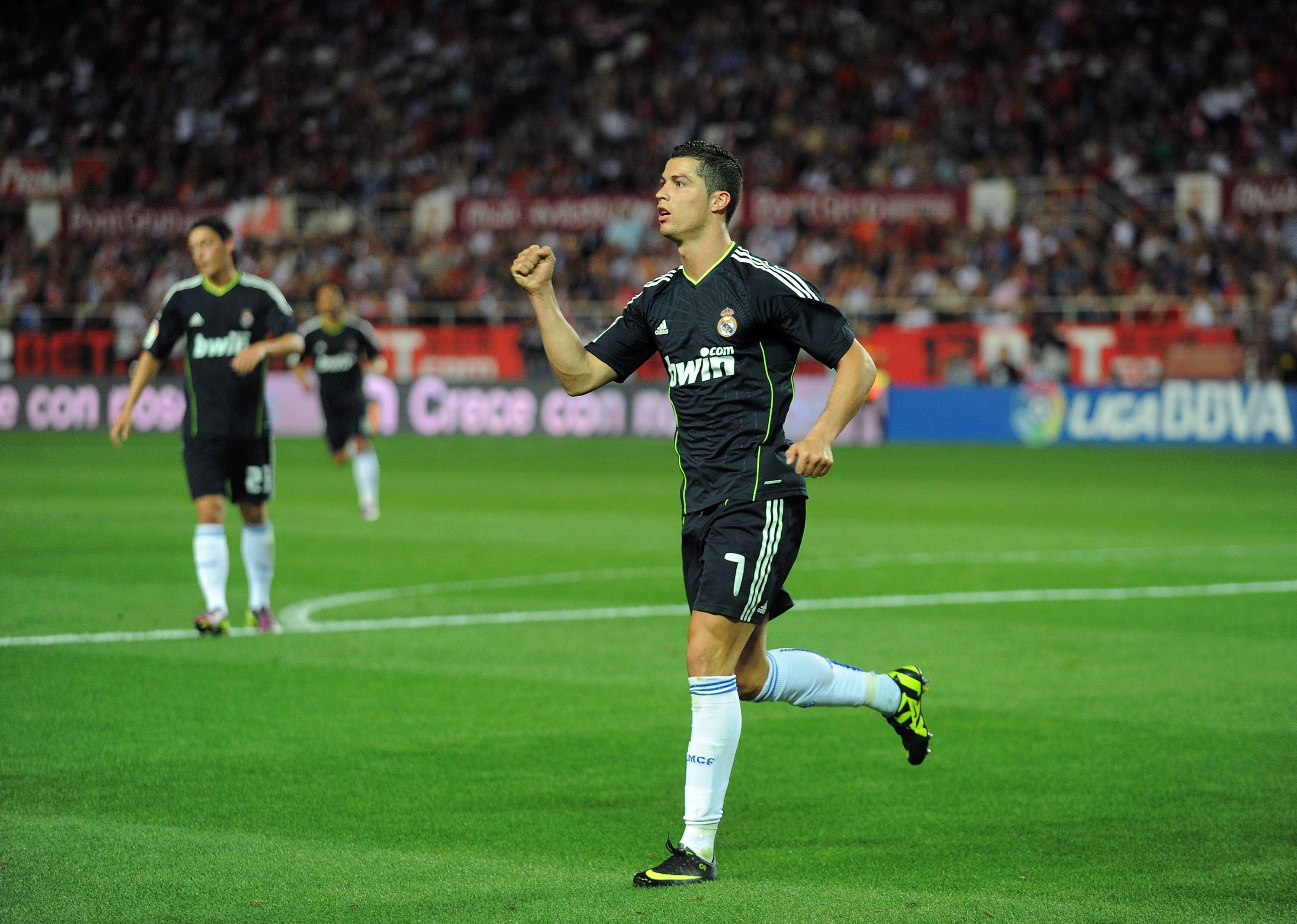 SEVILLE, SPAIN - MAY 07:  Cristiano Ronaldo of Real Madrid celebrates after he scored Real's fourth goal during the La Liga match betweenevilla and Real Madrid at Estadio Ramon Sanchez Pizjuan on May 7, 2011 in Seville, Spain.  (Photo by Denis Doyle/Getty