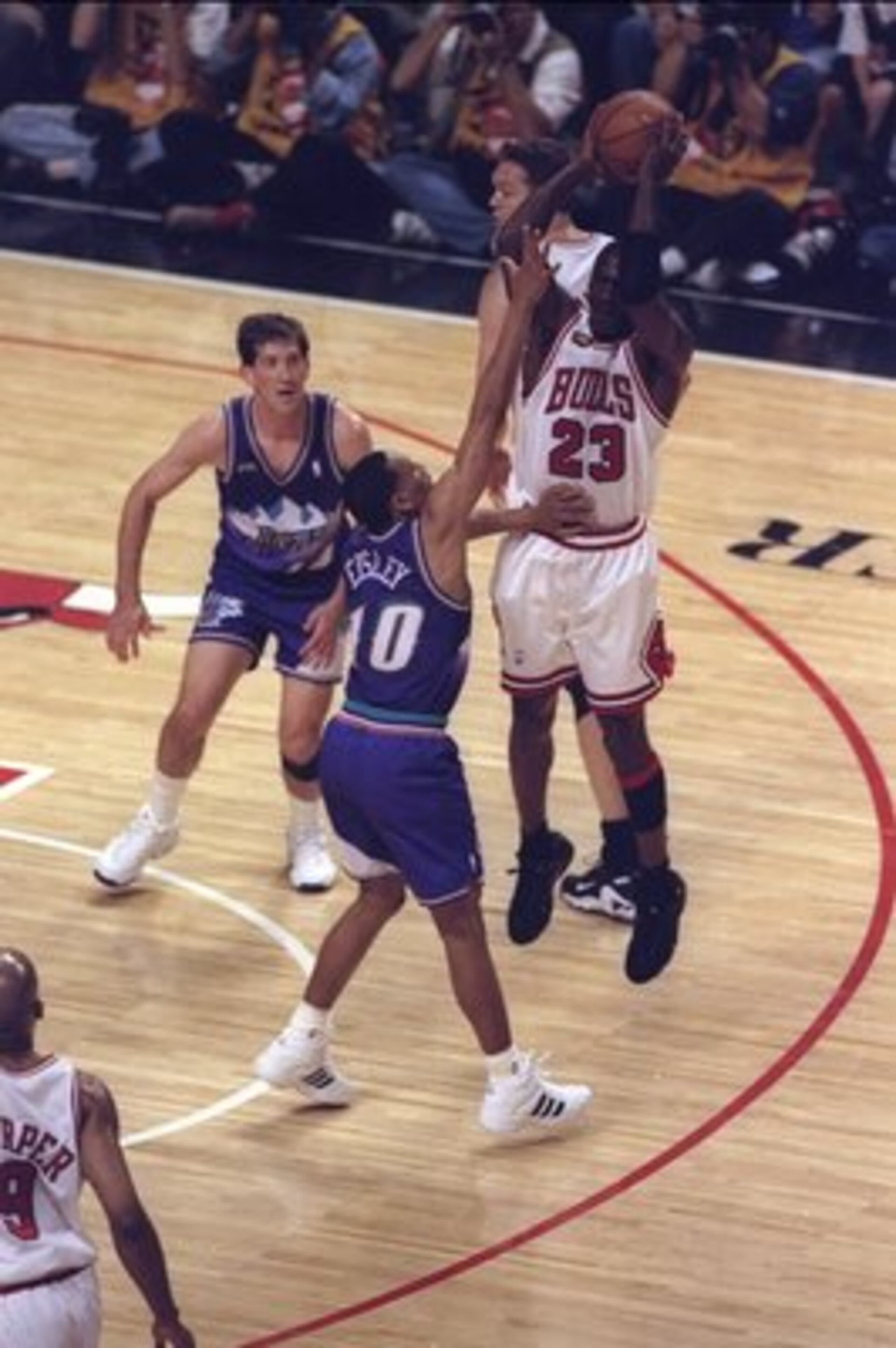 10 Jun 1998:  Michael Jordan #23 of the Chicago Bulls in action against Howard Eisley and Jeff Hornasek of the Utah Jazz during the NBA Finals Game 4 at the United Center in Chicago, Illinois.  The Bulls defeated the Jazz 86-82. Mandatory Credit: Jonathan