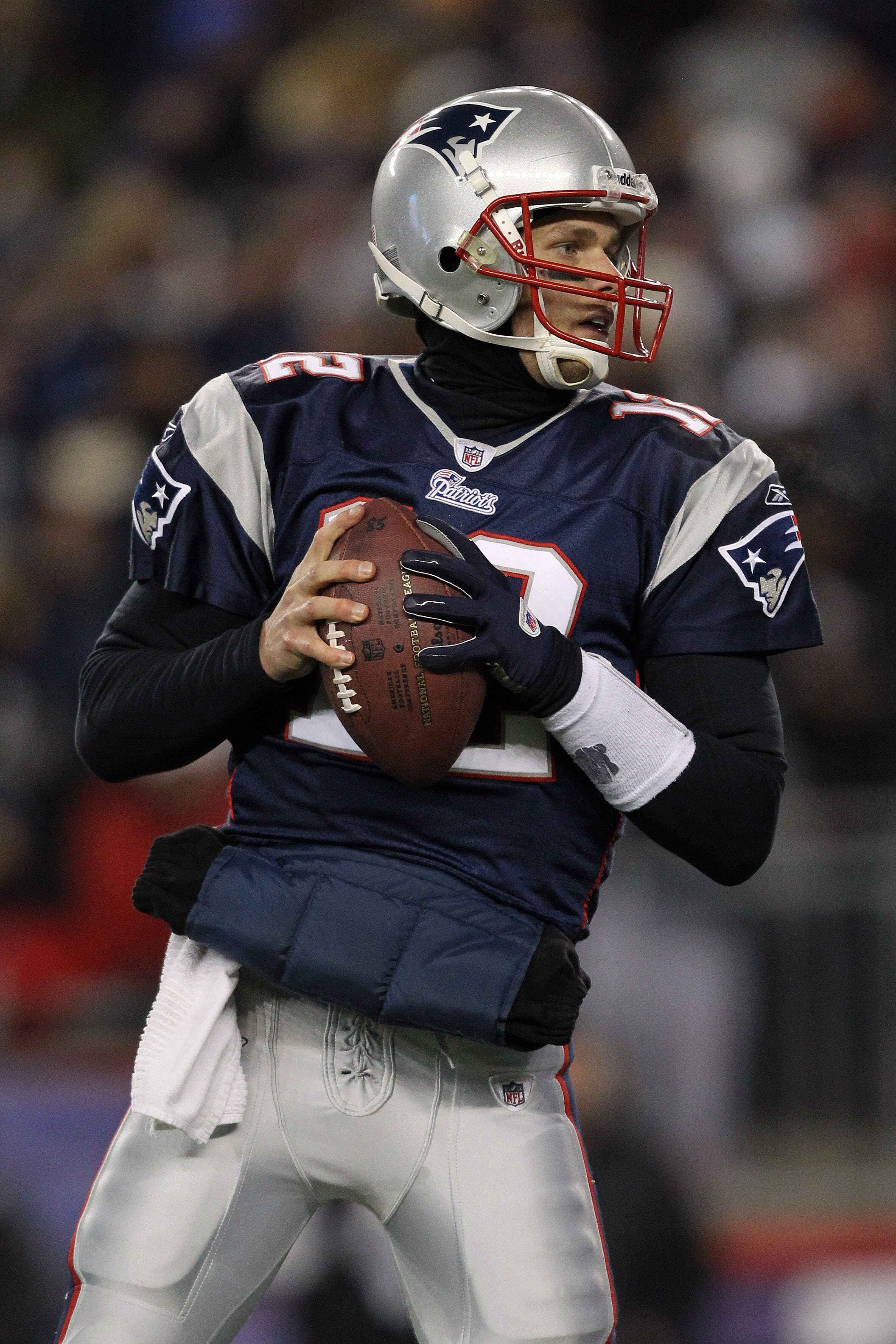FOXBORO, MA - JANUARY 16:  Quarterback Tom Brady #12 of the New England Patriots looks to pass during their 2011 AFC divisional playoff game against the New York Jets at Gillette Stadium on January 16, 2011 in Foxboro, Massachusetts.  (Photo by Al Bello/G