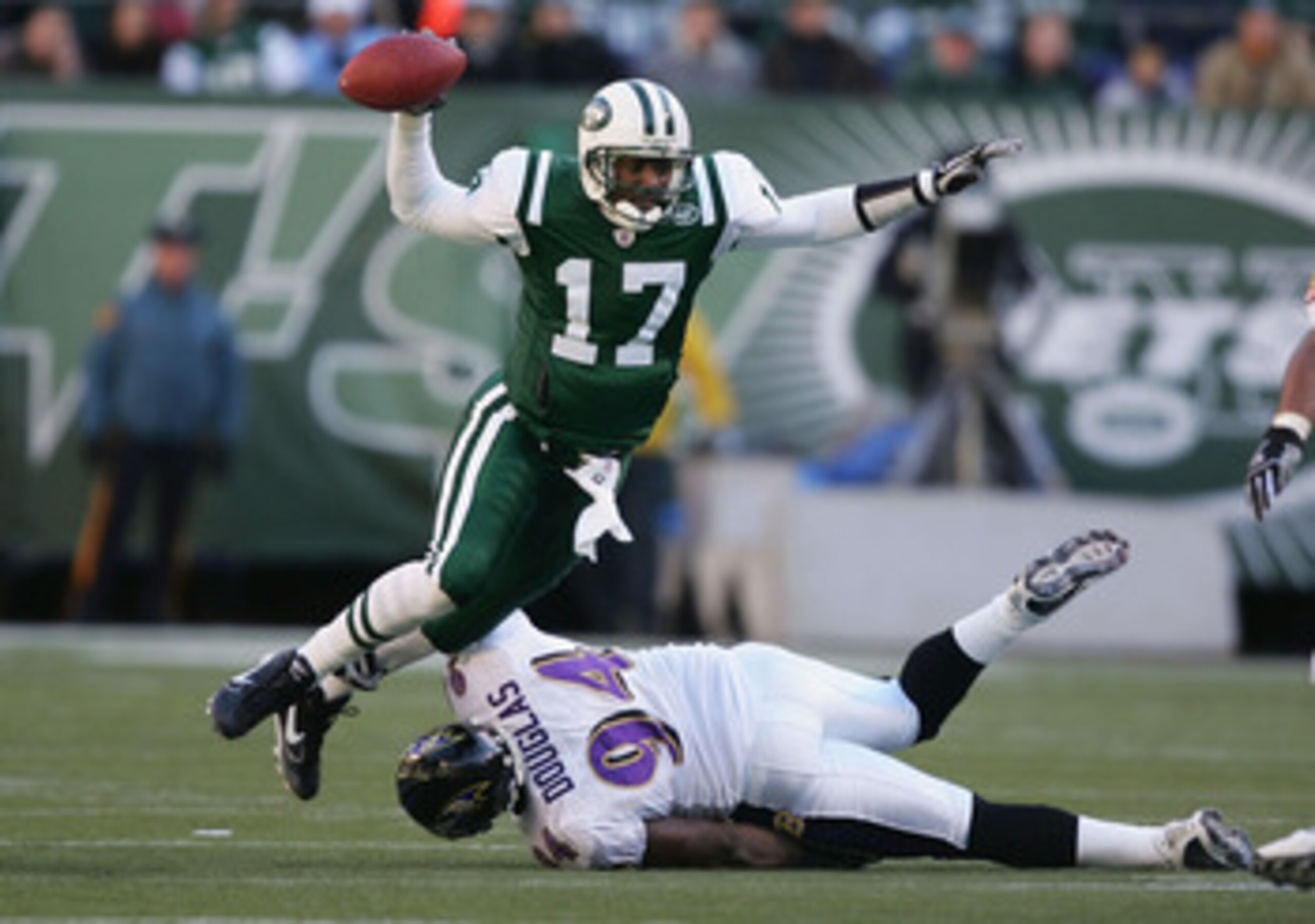 EAST RUTHERFORD, NJ - NOVEMBER 14:  Quincy Carter #17 of the New York Jets is sacked by Marques Douglas #94 of the Baltimore Ravens November 14, 2004 at Giants Stadium in East Rutherford, New Jersey.  (Photo by Al Bello/Getty Images)