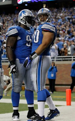 DETROIT - OCTOBER 31: Ndamukong Suh #90 of the Detroit Lions celebrates with teammate Corey Williams #99 after  recovering a late fourth quarter fumble from Rex Grossman #8 of the Washington Redskins an scores a touchdown at Ford Field on October 31, 2010
