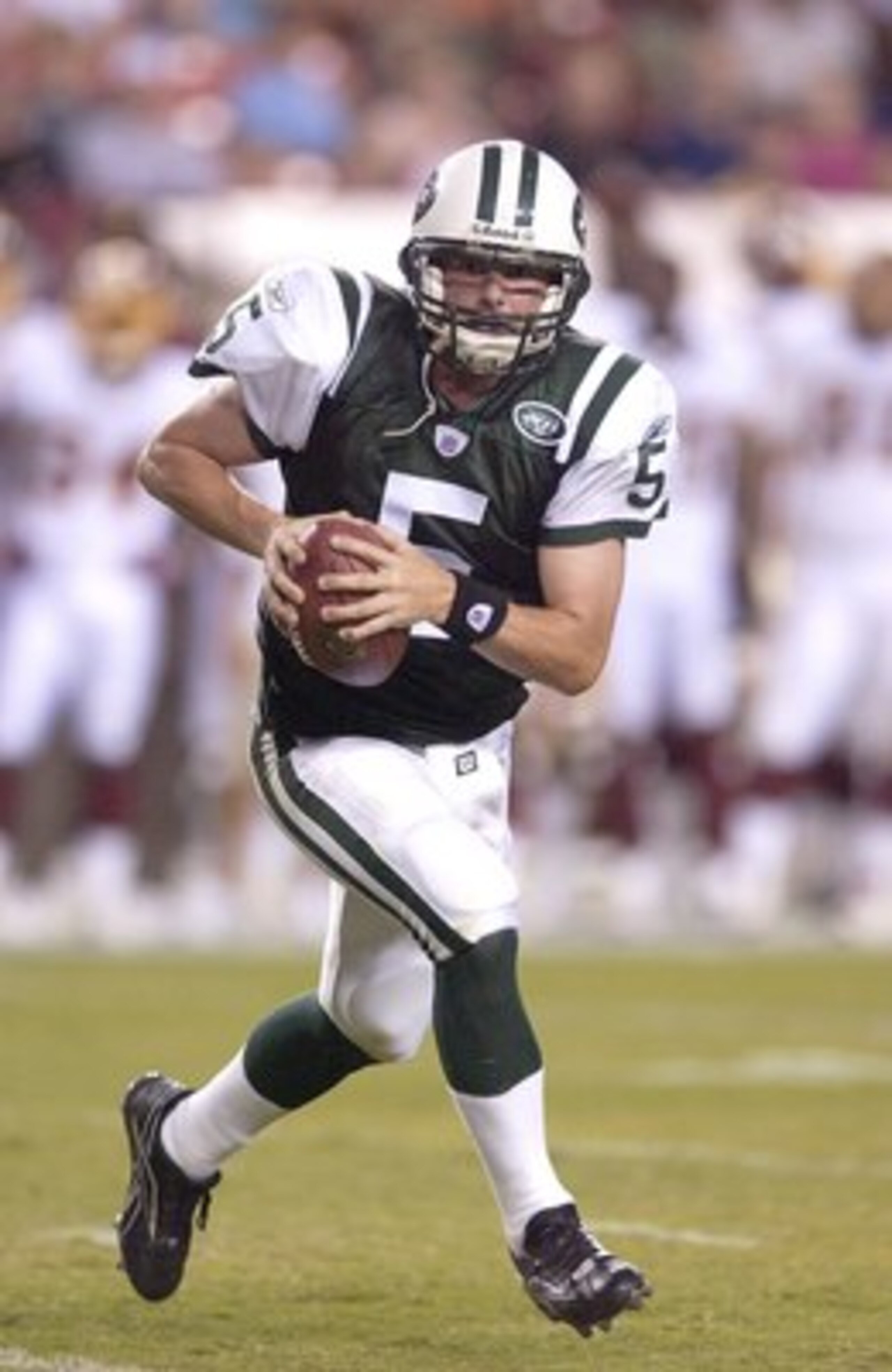 LANDOVER, MD - AUGUST 19:  New York Jets Brooks Bollinger #5 scrambles with the ball against the Washington Redskins August 19, 2006 at FedEx Field in Landover, Maryland.  (Photo by Greg Fiume/Getty Images)
