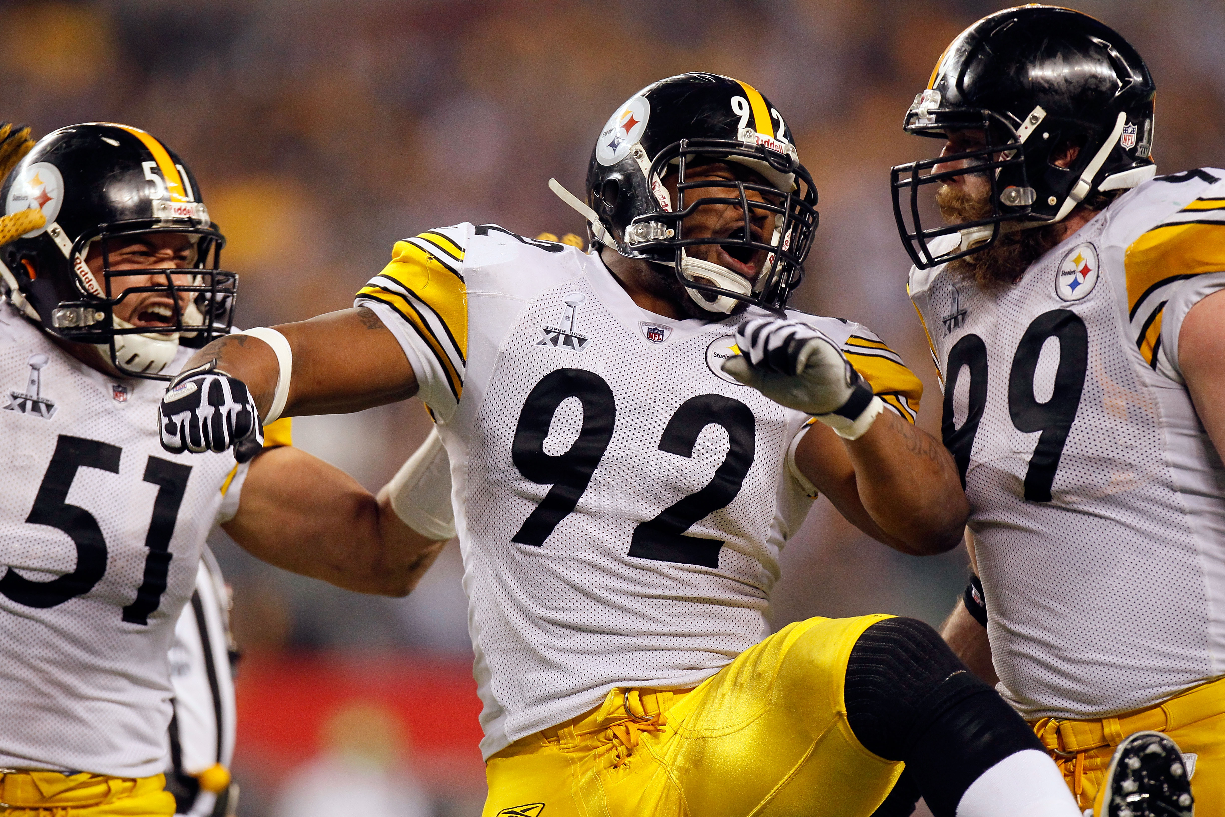 ARLINGTON, TX - FEBRUARY 06:  James Farrior #51, James Harrison #92 and Brett Keisel #99 of the Pittsburgh Steelers celebrate a defensive play against the Green Bay Packers during Super Bowl XLV at Cowboys Stadium on February 6, 2011 in Arlington, Texas.