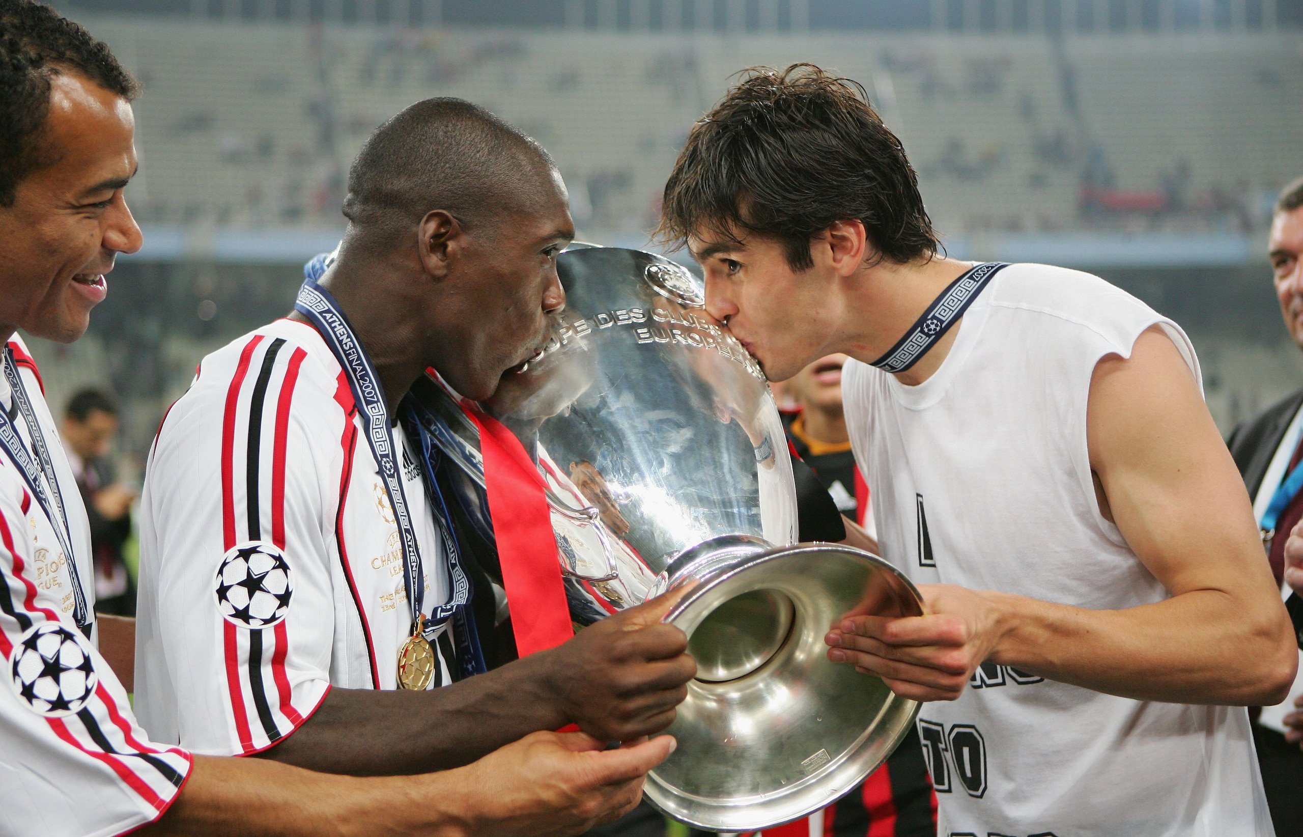 ATHENS, GREECE - MAY 23:  (L to R) Milan teammates Clarence Seedorf and Kaka kiss the trophy following their teams 2-1 victory during the UEFA Champions League Final match between Liverpool and AC Milan at the Olympic Stadium on May 23, 2007 in Athens, Gr