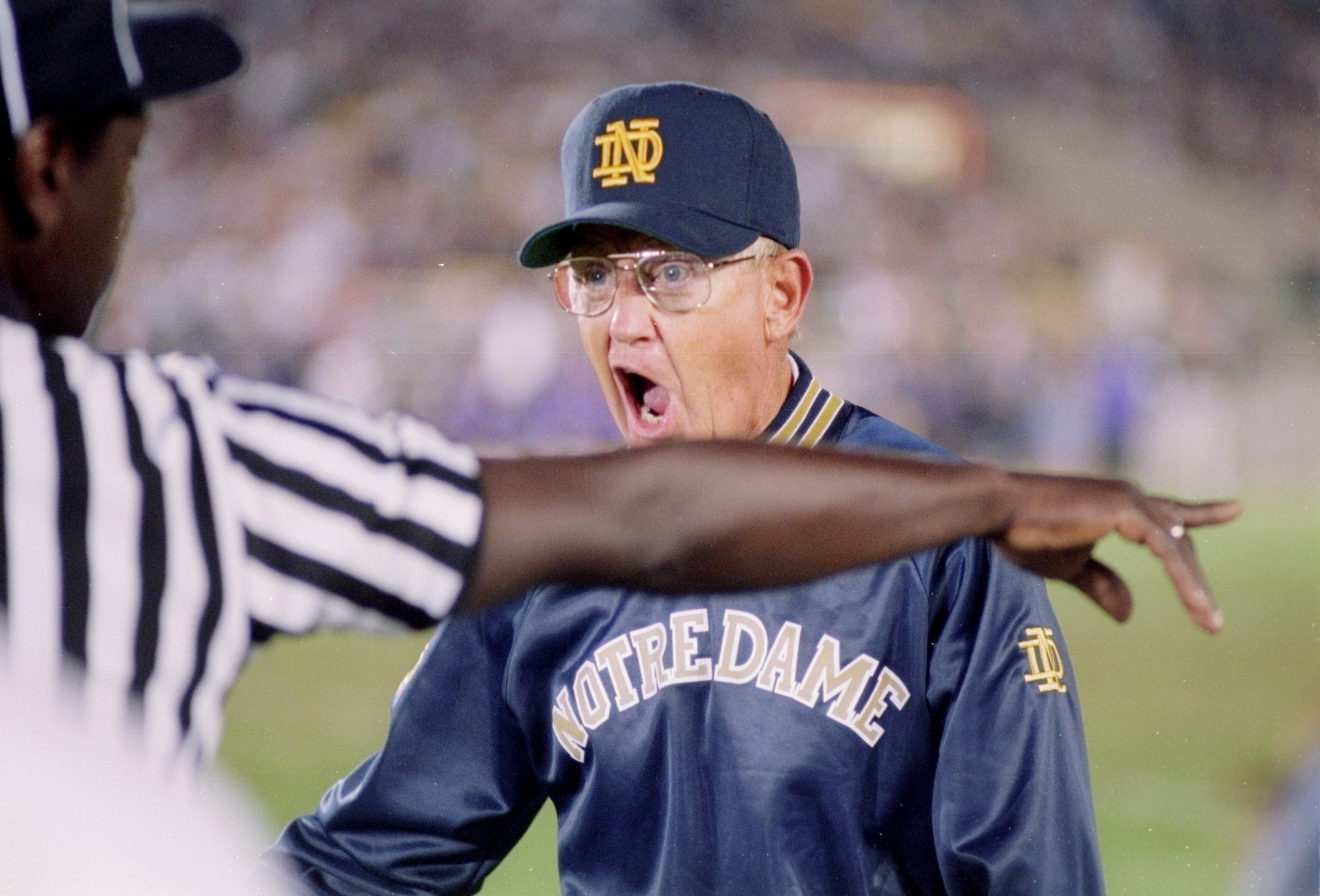 3 Sep 1994:  Coach Lou Holtz of the Notre Dame Fighting Irish argues with the official during a game against the Northwestern Wildcats.  Notre Dame won the game 42-15. Mandatory Credit: Jonathan Daniel  /Allsport