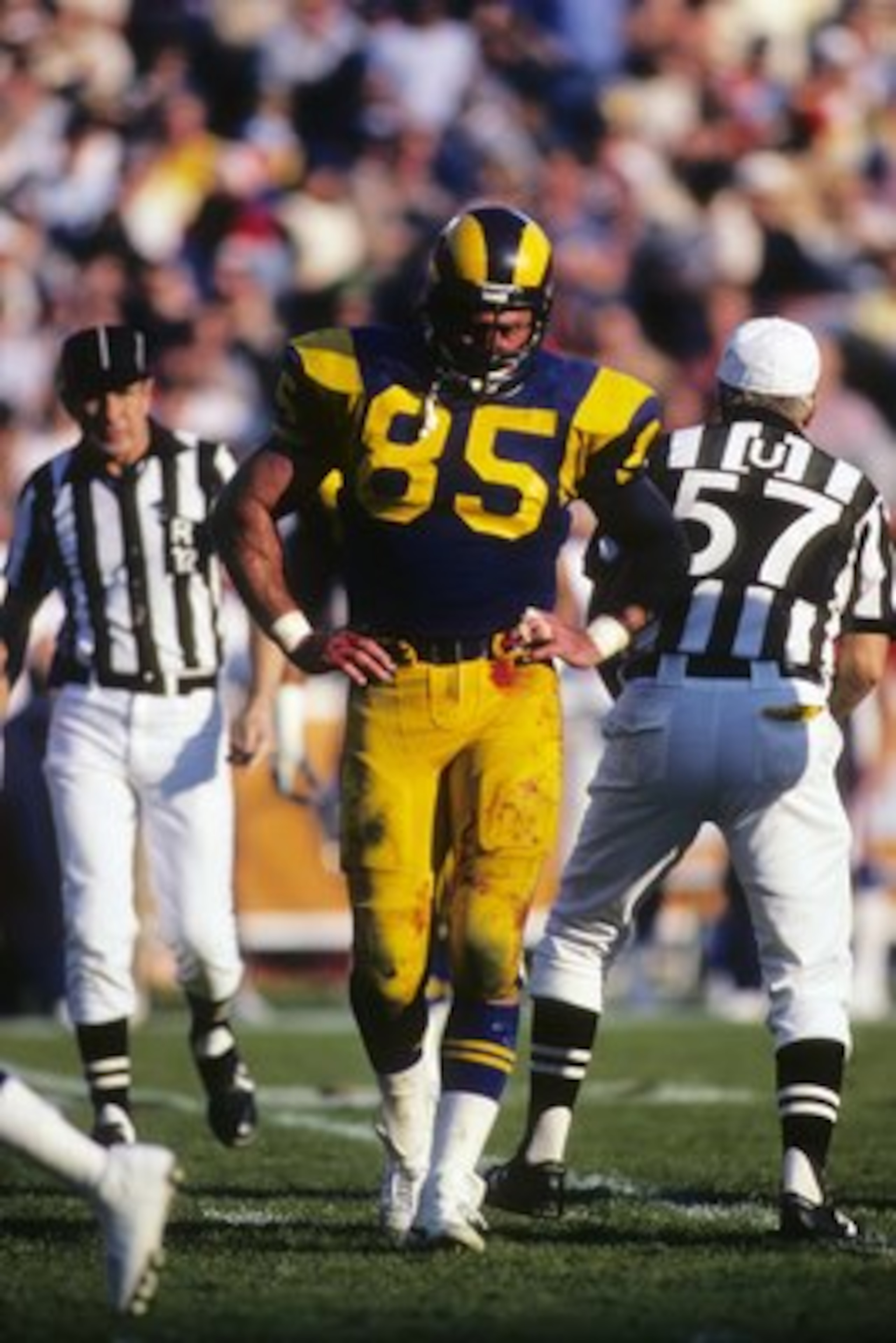 ANAHEIM, CA - DECEMBER 23:  Defensive end Jack Youngblood #85 of the Los Angeles Rams walk on the field during the 1984 NFC Wild Card playoff game against the New York Giants at Anaheim Stadium on December 23, 1984 in Anaheim, California.   The Giants won