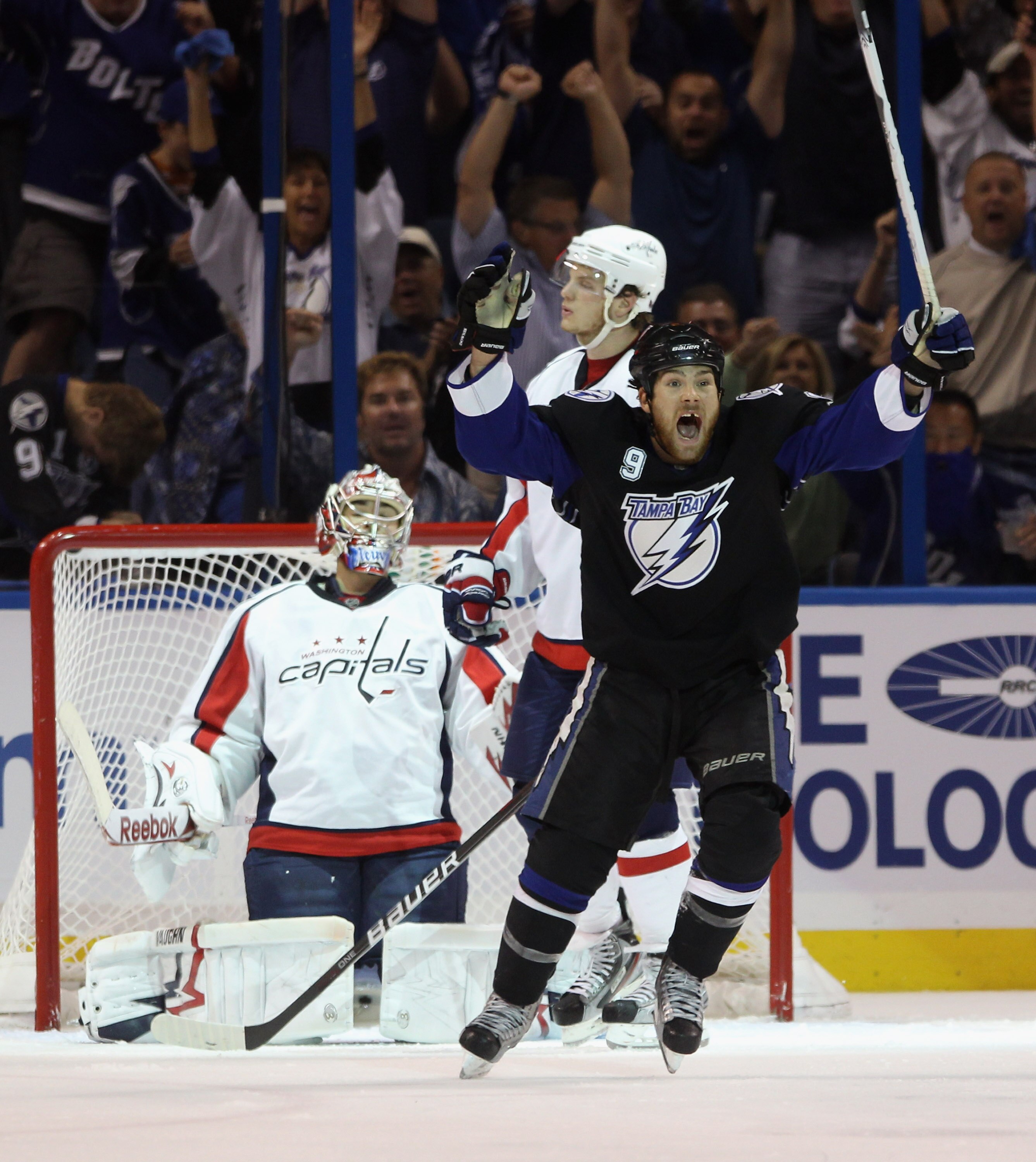 TAMPA, FL - MAY 04:  Steve Downie #9 of the Tampa Bay Lightning celebrates the game winning goal by Marc-Andre Bergeron #47 at 5:07 of the third period against the Washington Capitals  in Game Four of the Eastern Conference Semifinals during the 2011 NHL 