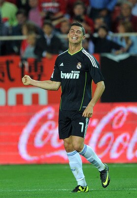 SEVILLE, SPAIN - MAY 07:  Cristiano Ronaldo of Real Madrid celebrates after he scored Real's sixth goal during the La Liga match betweenevilla and Real Madrid at Estadio Ramon Sanchez Pizjuan on May 7, 2011 in Seville, Spain.  (Photo by Denis Doyle/Getty