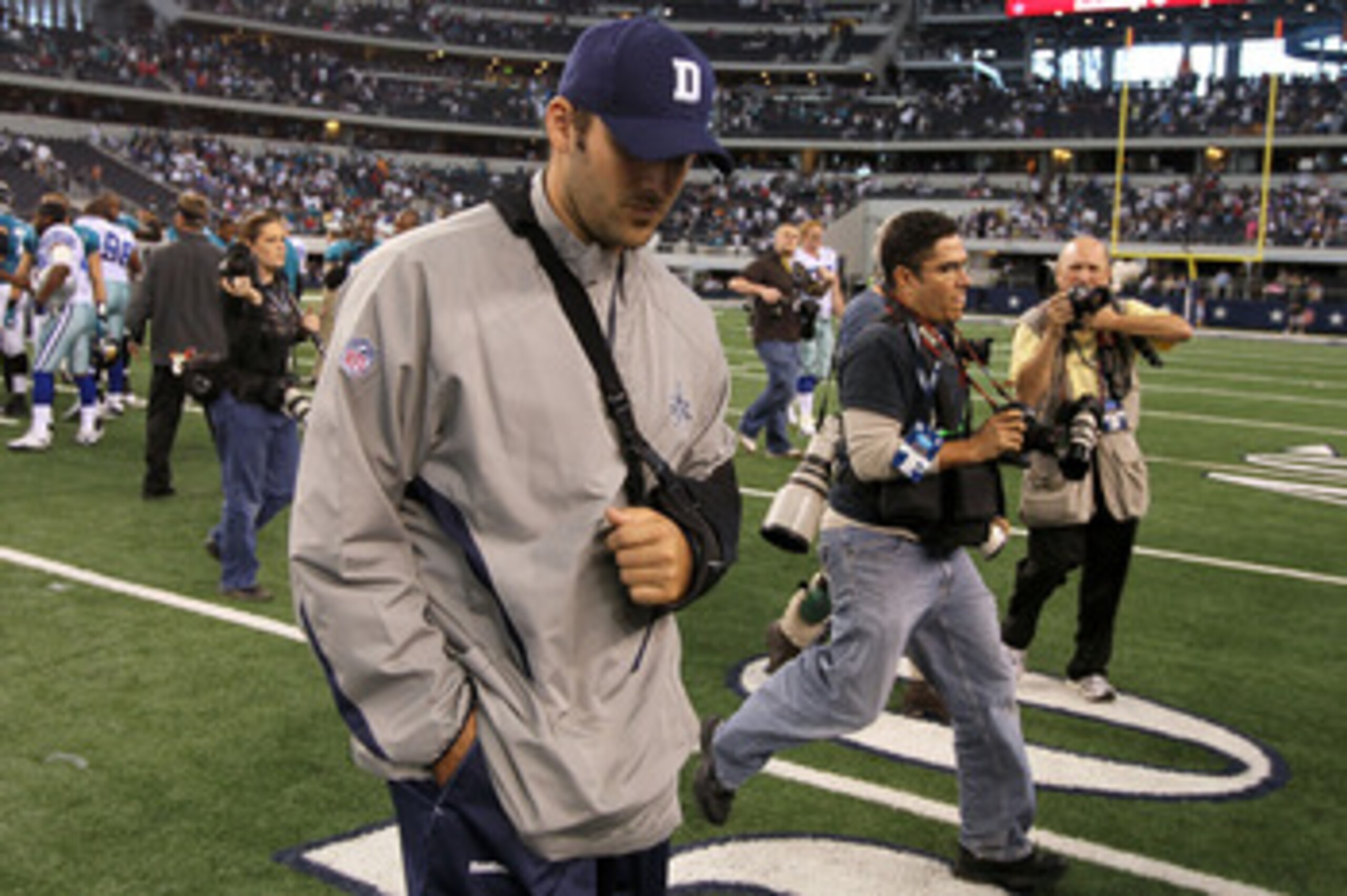 ARLINGTON, TX - OCTOBER 31:  Injured quarterback Tony Romo of the Dallas Cowboys walks off the field with his head down after the Cowboys lost 35-17 against the Jacksonville Jaguars at Cowboys Stadium on October 31, 2010 in Arlington, Texas.  (Photo by St