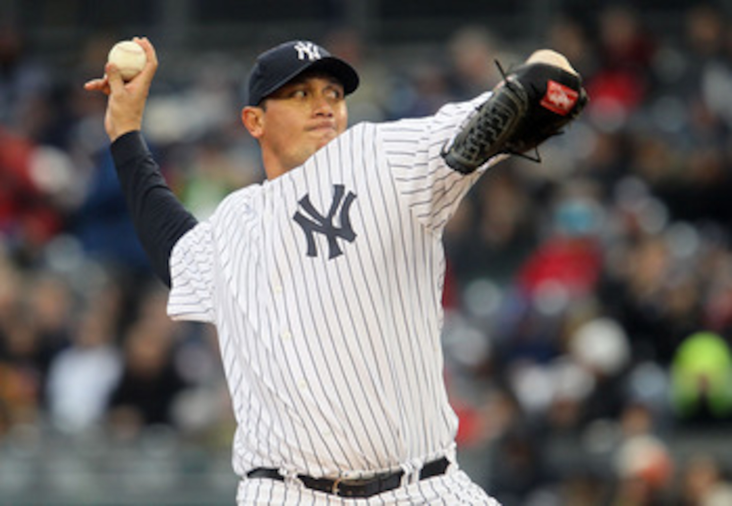 NEW YORK, NY - APRIL 16:  Freddy Garcia #36 of the New York Yankees delivers a pitch against the Texas Rangers on April 16, 2011 at Yankee Stadium in the Bronx borough of New York City.  (Photo by Jim McIsaac/Getty Images)