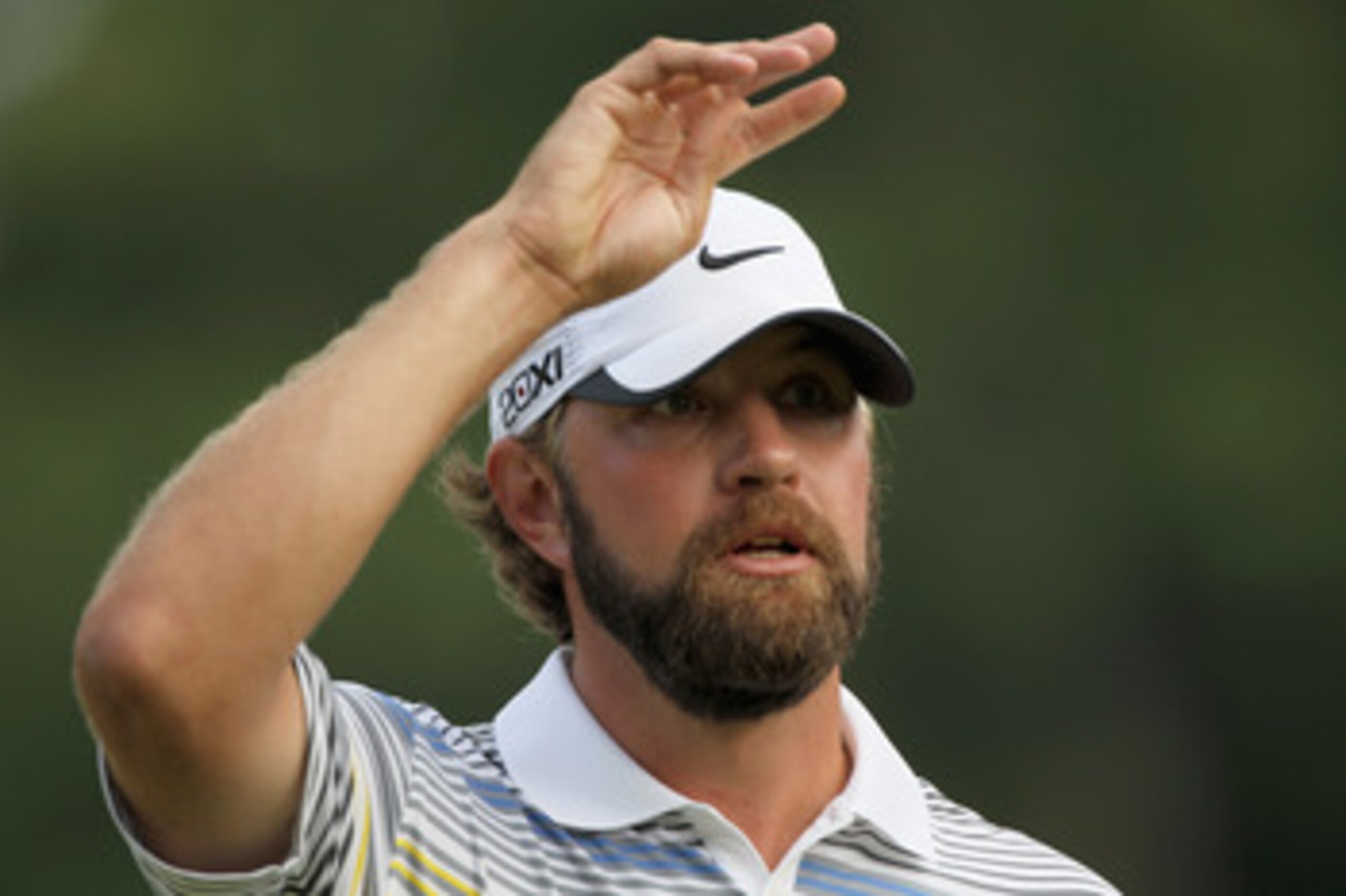 CHARLOTTE, NC - MAY 08:  Lucas Glover waves to the gallery on the 18th green after defeating Jonathan Byrd on the first playoff hole during the final round of the Wells Fargo Championship at the Quail Hollow Club on May 8, 2011 in Charlotte, North Carolin