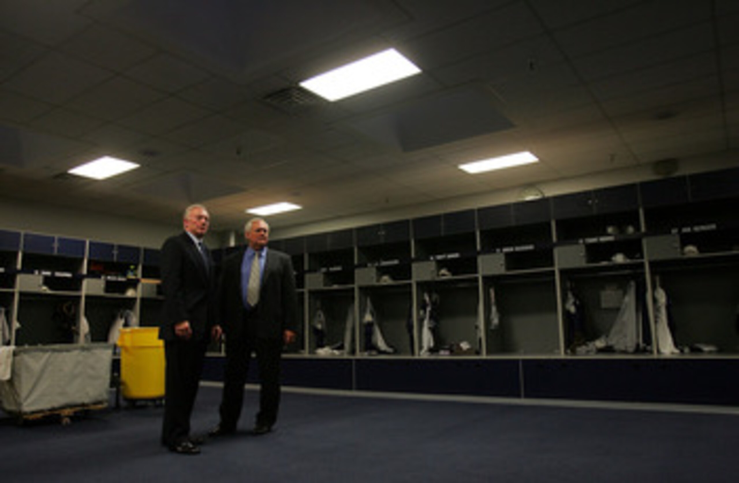 IRVING, TX - FEBRUARY 08:  Wade Phillips,  new Dallas Cowboys coach and Jerry Jones, owner  of the Dallas Cowboys walk through the Dallas Cowboys locker room on February 8, 2007 in Irving, Texas.  (Photo by Ronald Martinez/Getty Images)