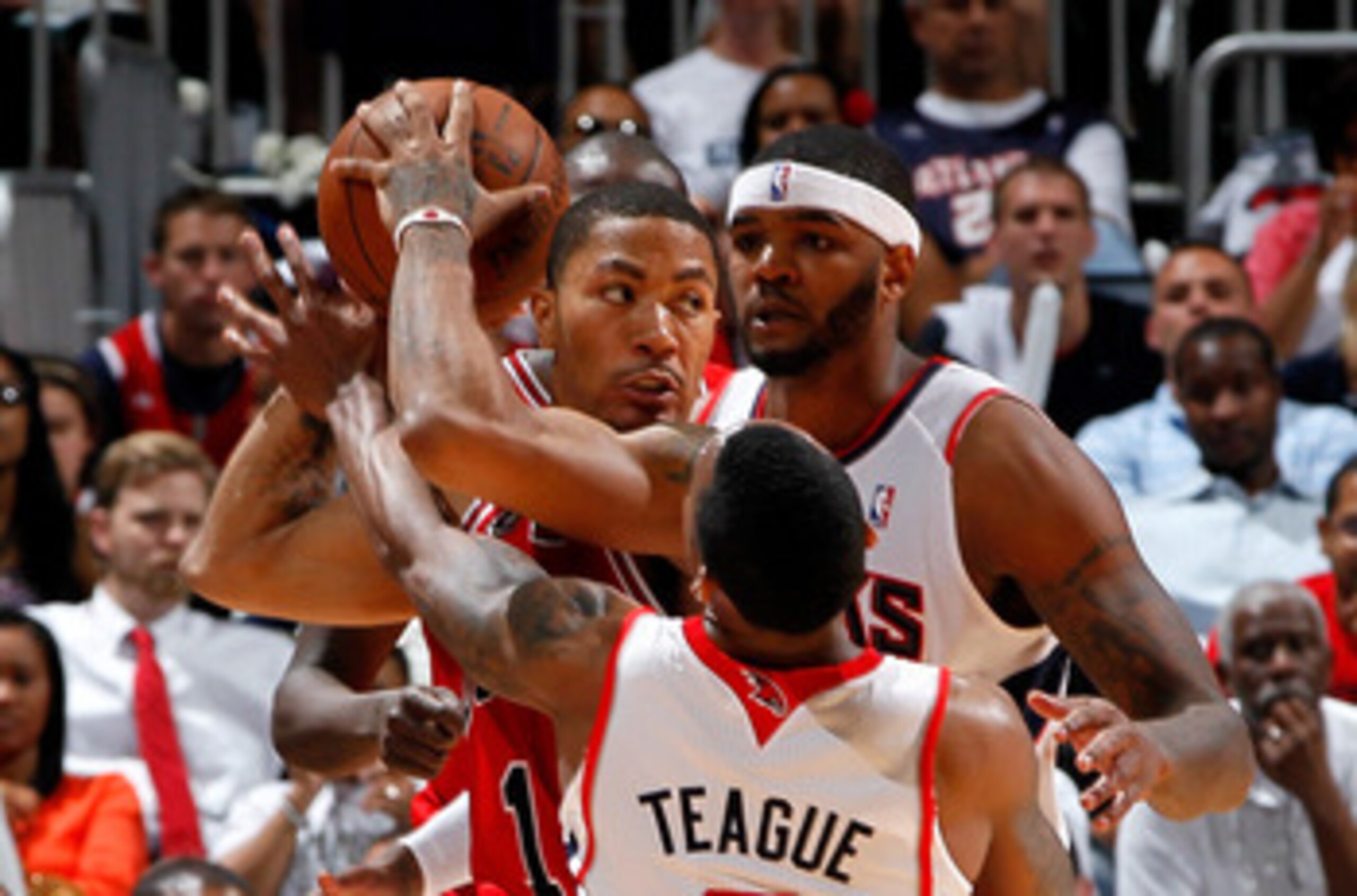 ATLANTA, GA - MAY 08:  Jeff Teague #0 and Josh Smith #5 of the Atlanta Hawks trap Derrick Rose #1 of the Chicago Bulls in Game Four of the Eastern Conference Semifinals in the 2011 NBA Playoffs at Phillips Arena on May 8, 2011 in Atlanta, Georgia.  NOTE T