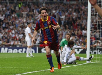 MADRID, SPAIN - APRIL 27:  Lionel Messi of Barcelona celebrates after scoring his first goal during the UEFA Champions League Semi Final first leg match between Real Madrid and Barcelona at Estadio Santiago Bernabeu on April 27, 2011 in Madrid, Spain.  (P