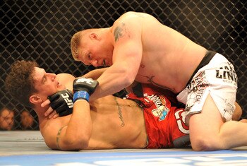 LAS VEGAS - JULY 11:  Brock Lesnar holds down Frank Mir during their heavyweight title bout during UFC 100 on July 11, 2009 in Las Vegas, Nevada.  (Photo by Jon Kopaloff/Getty Images)