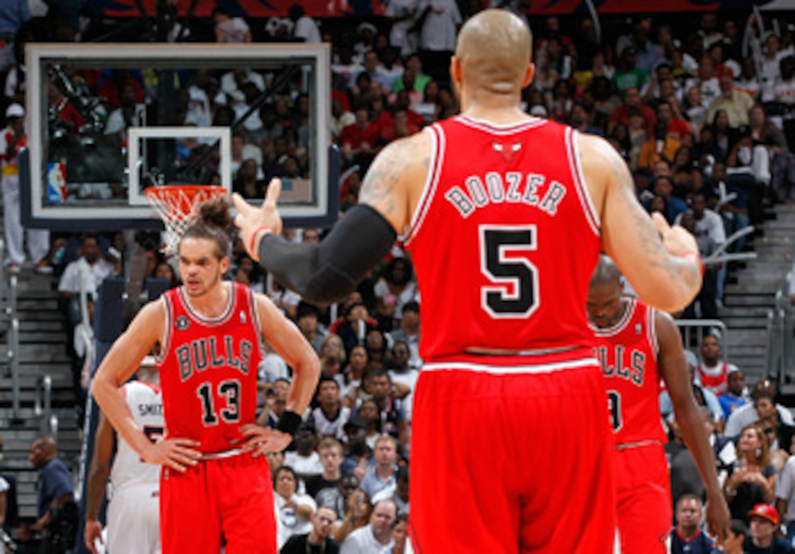 ATLANTA, GA - MAY 08:  Joakim Noah #13, Luol Deng #9 and Carlos Boozer #5 of the Chicago Bulls react after Noah was called for a foul against the Atlanta Hawks in Game Four of the Eastern Conference Semifinals in the 2011 NBA Playoffs at Phillips Arena on