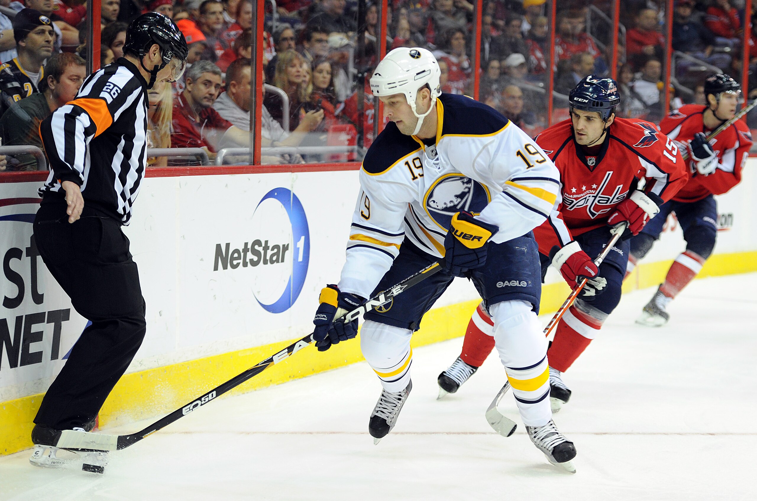 WASHINGTON - NOVEMBER 17:  Tim Connolly #19 of the Buffalo Sabres keeps the puck away from Boyd Gordon #15 of the Washington Capitals at the Verizon Center on November 17, 2010 in Washington DC.  (Photo by Greg Fiume/Getty Images)