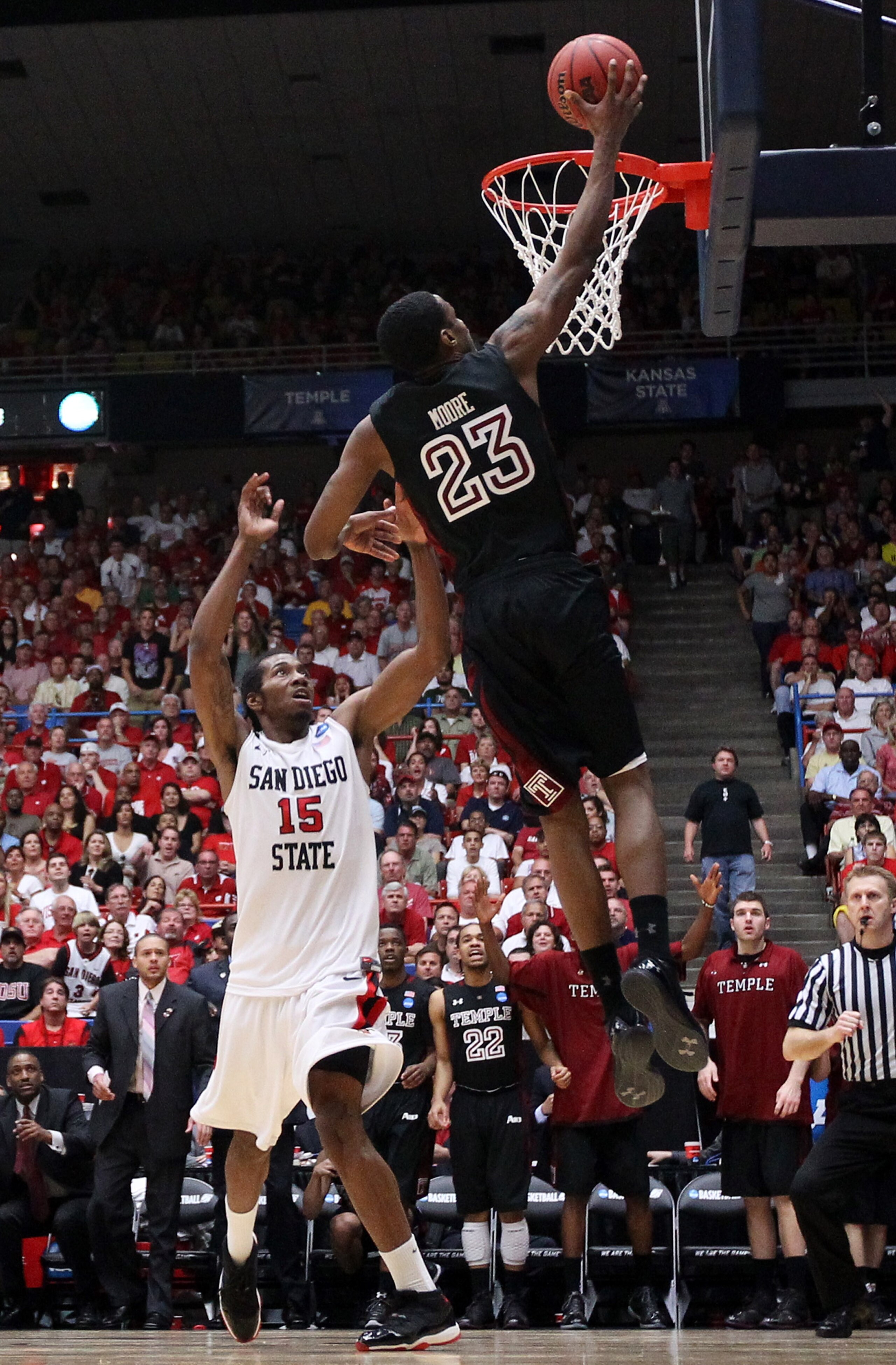 TUCSON, AZ - MARCH 19:  Ramone Moore #23 of the Temple Owls shoots over Kawhi Leonard #15 of the San Diego State Aztecs during the third round of the 2011 NCAA men's basketball tournament at McKale Center on March 19, 2011 in Tucson, Arizona.  (Photo by C