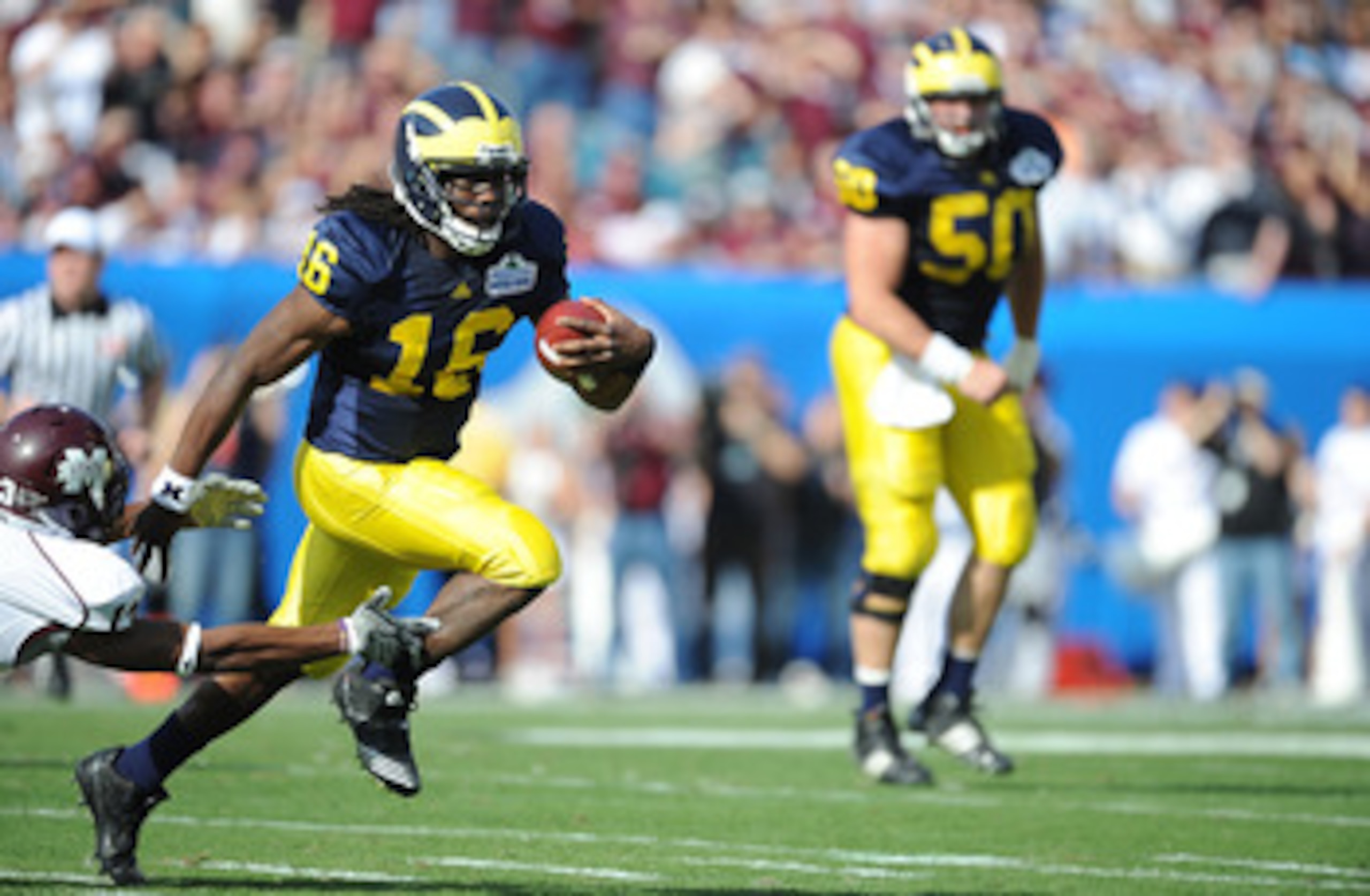 JACKSONVILLE, FL - JANUARY 01: Quarterback Denard Robinson #16 of the Michigan Wolverines rushes against the Mississippi State Bulldogs during the Gator Bowl at EverBank Field on January 1, 2011 in Jacksonville, Florida (Photo by Rick Dole/Getty Images) JACKSONVILLE, FL - JANUARY 01: Quarterback Denard Robinson #16 of the Michigan Wolverines rushes against the Mississippi State Bulldogs during the Gator Bowl at EverBank Field on January 1, 2011 in Jacksonville, Florida (Photo by Rick Dole/Getty Images)