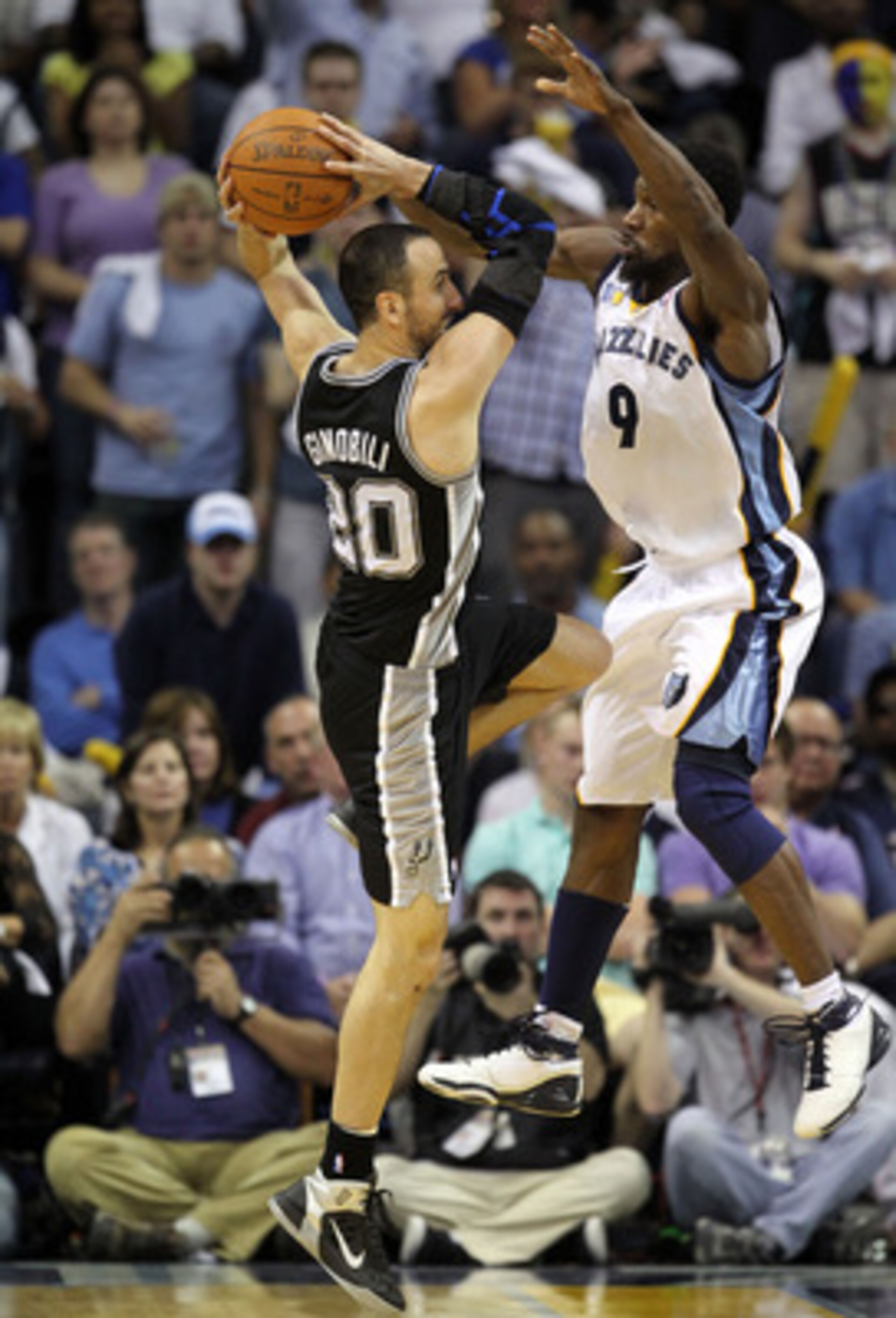 MEMPHIS, TN - APRIL 23:  Manu Ginobili #3 of the San Antonio Spurs passes the ball while defended by Tony Allen #9 of the Memphis Grizzlies in Game three of the Western Conference Quarterfinals in the 2011 NBA Playoffs at FedExForum on April 23, 2011 in M