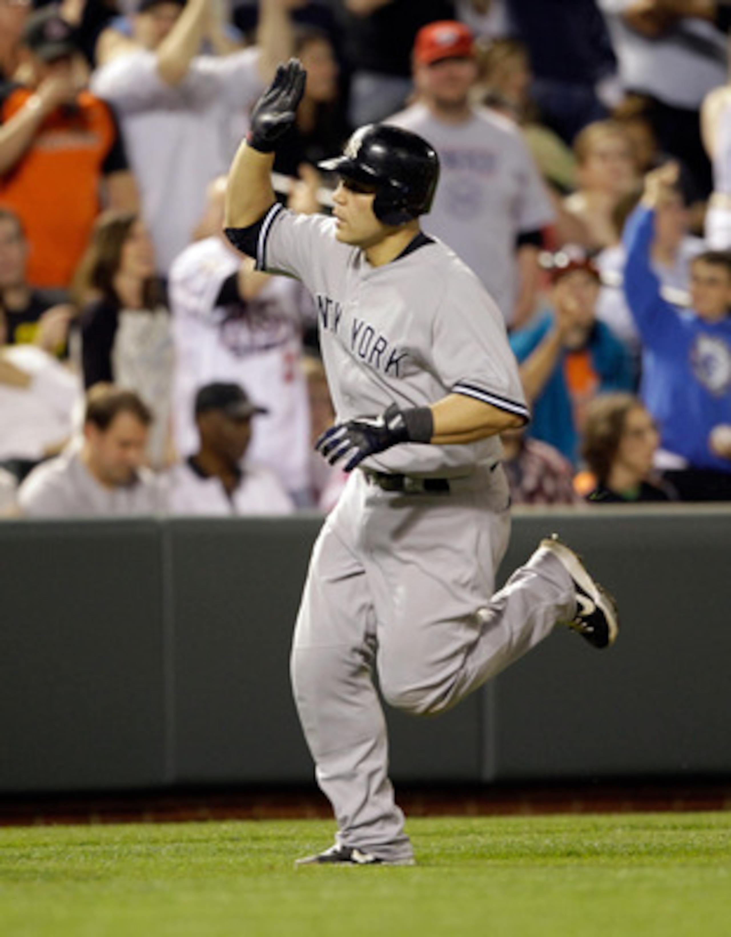 BALTIMORE, MD - APRIL 23:  Russell Martin #55 of the New York Yankees after hitting a solo homerun during the eighth inning against the Baltimore Orioles at Oriole Park at Camden Yards on April 23, 2011 in Baltimore, Maryland.  (Photo by Rob Carr/Getty Im