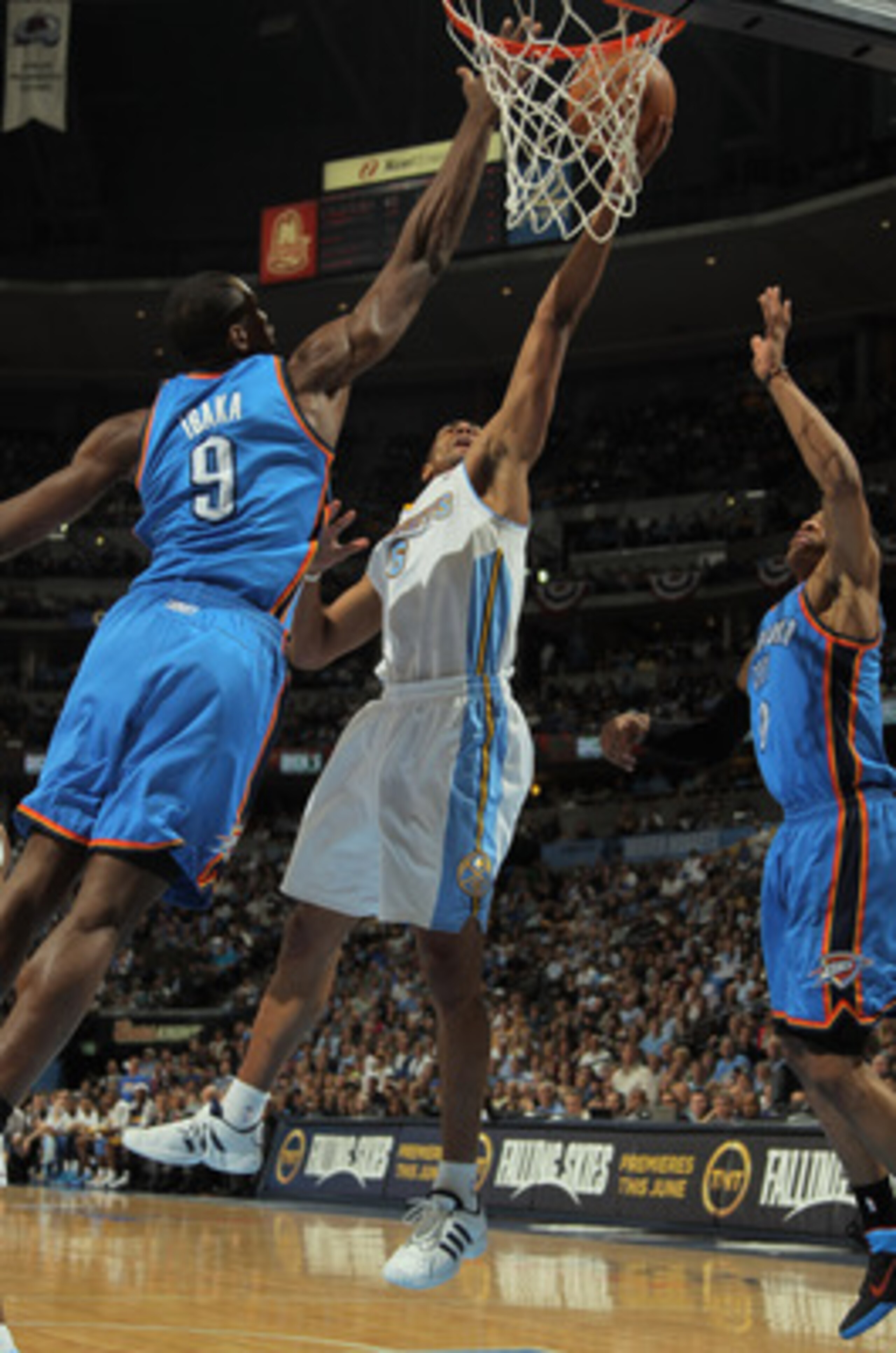 DENVER, CO - APRIL 25:  Arron Afflalo #6 of the Denver Nuggets lays up a shot between Serge Ibaka #9 of the Oklahoma City Thunder and Russell Westbrook #0 of the Oklahoma City Thunder in Game Four of the Western Conference Quarterfinals in the 2011 NBA Pl