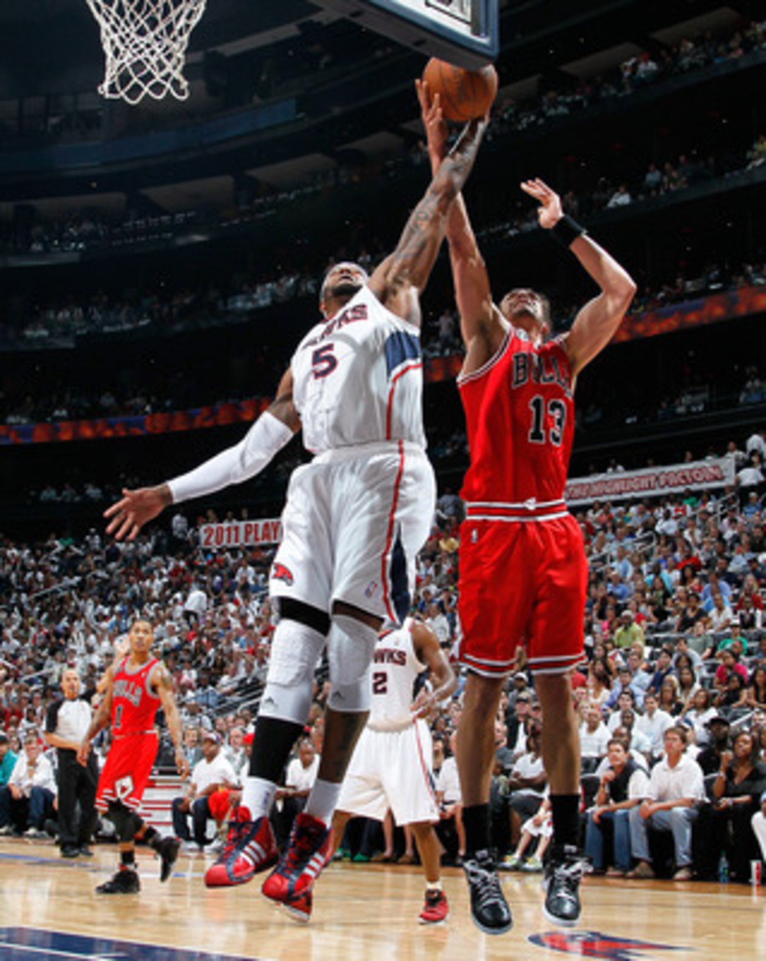 ATLANTA, GA - MAY 08:  Josh Smith #5 of the Atlanta Hawks battles for a rebound against Joakim Noah #13 of the Chicago Bulls in Game Four of the Eastern Conference Semifinals in the 2011 NBA Playoffs at Phillips Arena on May 8, 2011 in Atlanta, Georgia.  