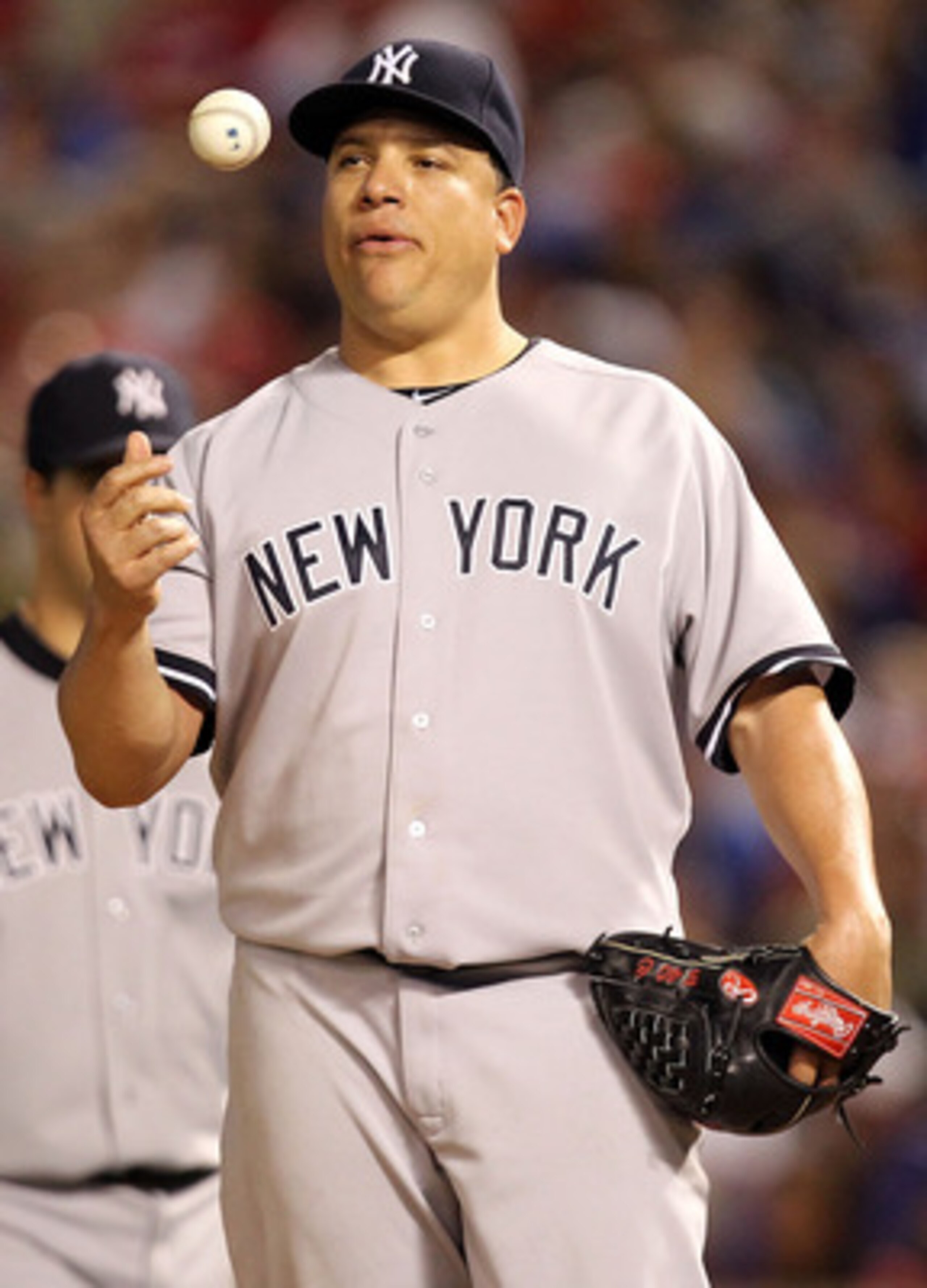 ARLINGTON, TX - MAY 07:  Pitcher Bartolo Colon #40 of the New York Yankees throws the ball in the air before being relieved against the Texas Rangers at Rangers Ballpark in Arlington on May 7, 2011 in Arlington, Texas.  (Photo by Ronald Martinez/Getty Ima
