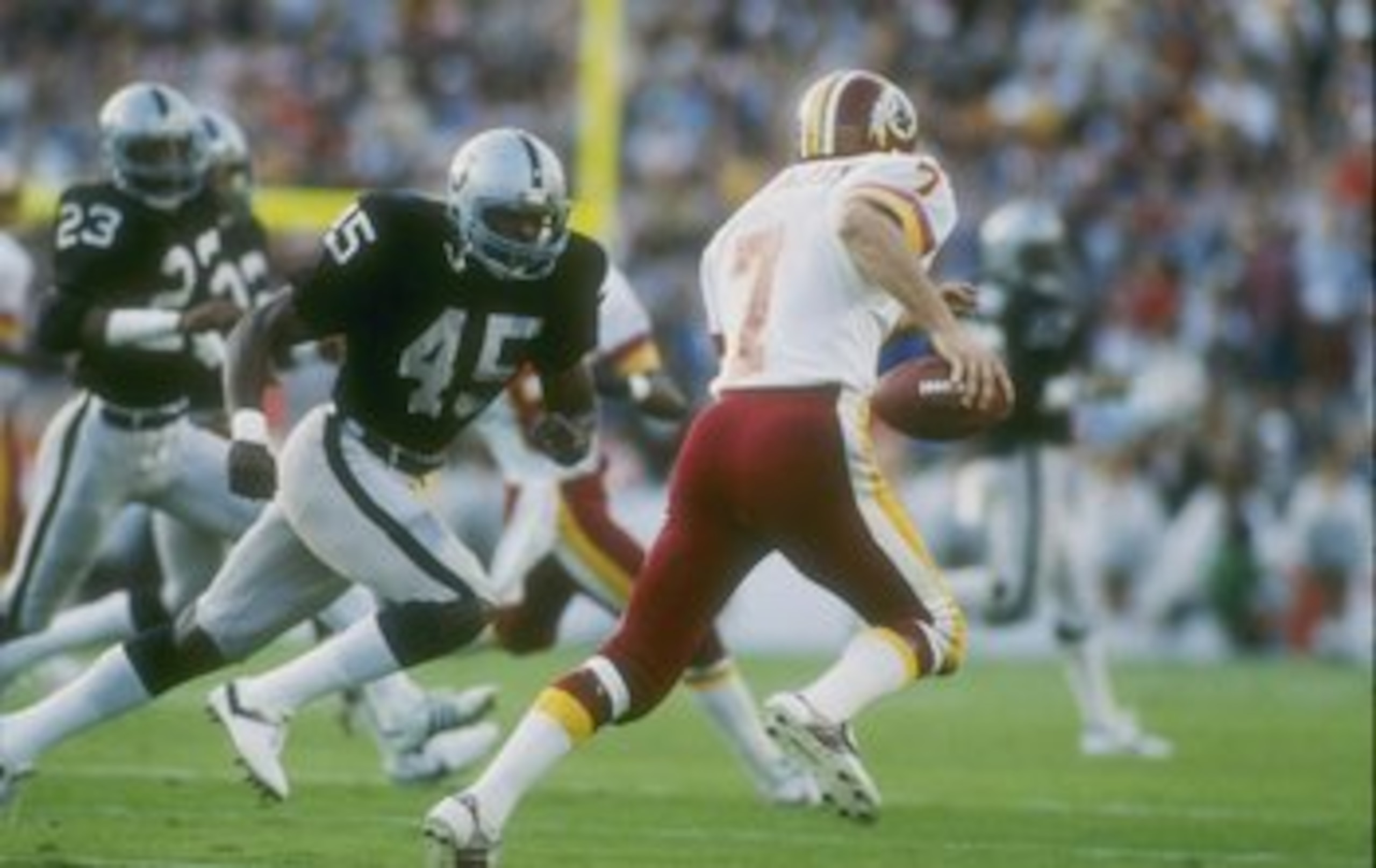 22  Jan 1984:   Quarterback Joe Theismann #7 of the Washington Redskins keeps moving during Super Bowl XVIII against the Los Angeles Raiders at Tampa Stadium in Tampa, Florida.The Raiders won the game 38-9. Mandatory Credit: Allsport  /Allsport