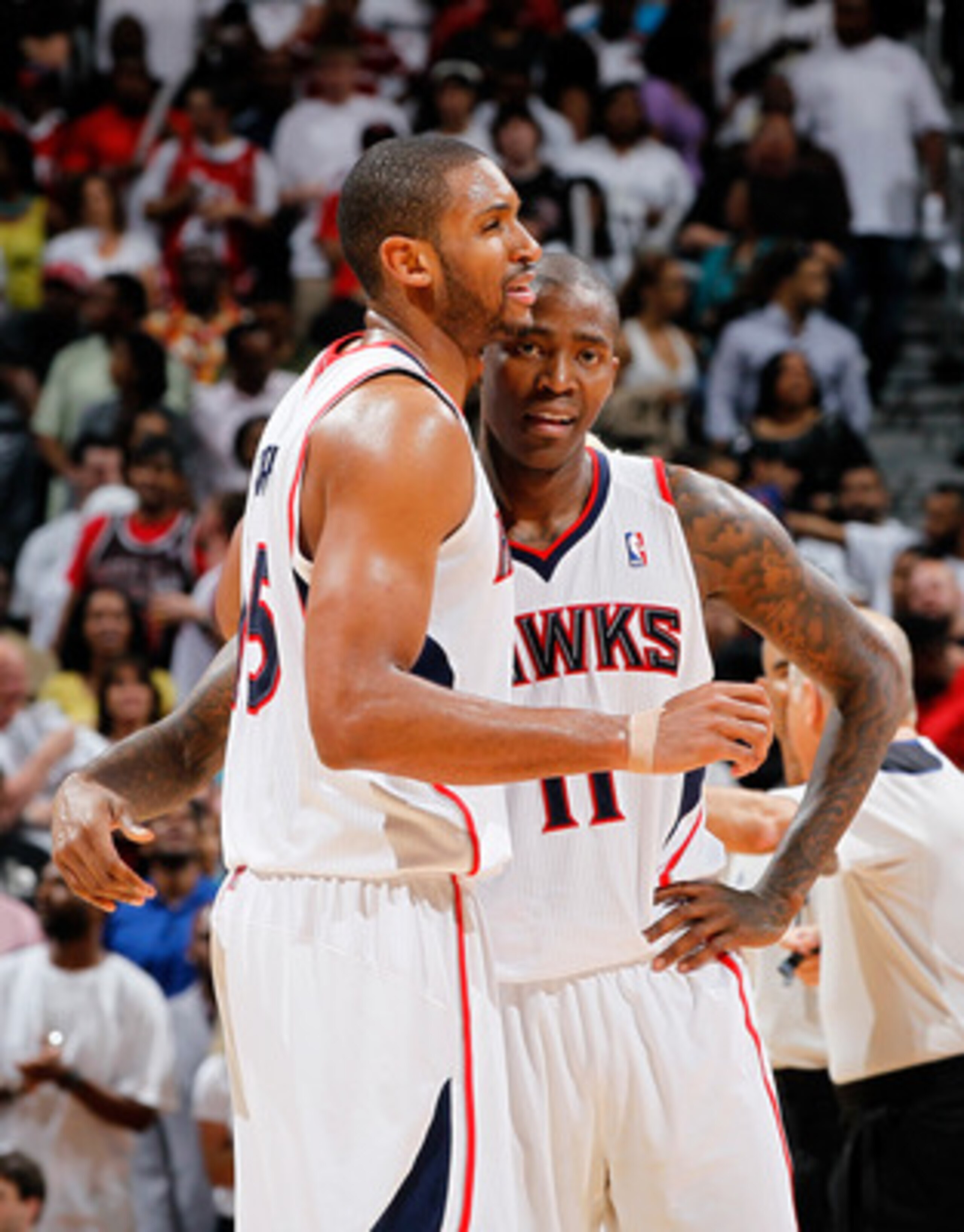 ATLANTA, GA - MAY 08:  Al Horford #15 and Jamal Crawford #11 of the Atlanta Hawks react in the final seconds of their 100-88 win over the Chicago Bulls in Game Four of the Eastern Conference Semifinals in the 2011 NBA Playoffs at Phillips Arena on May 8, 