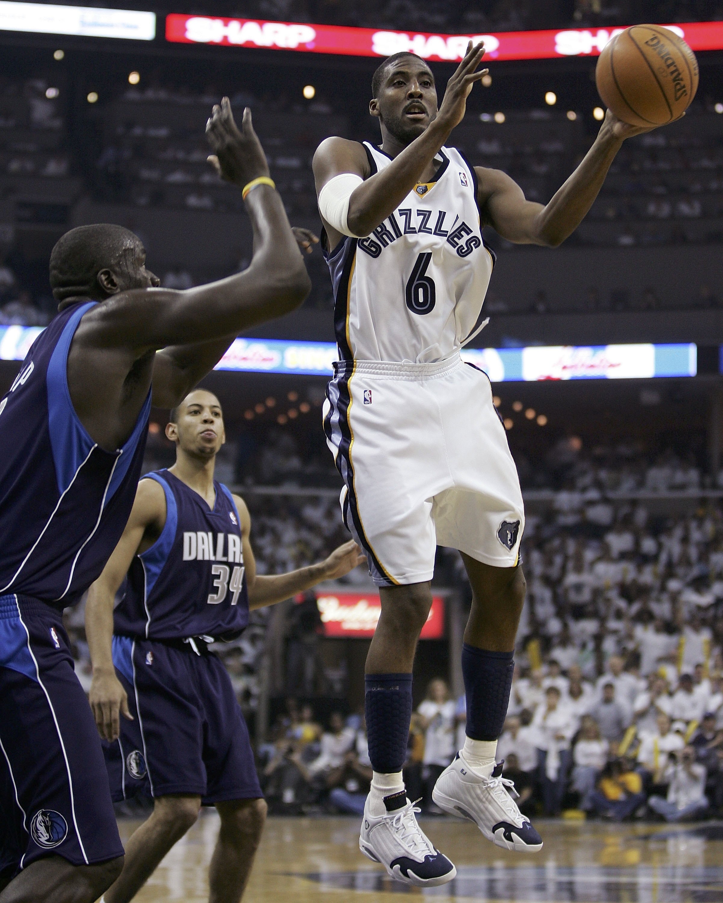MEMPHIS, TN - APRIL 29:  Eddie Jones #6 of the Memphis Grizzlies looks to pass as DeSagana Diop #7 of the Dallas Mavericks defends in game three of the Western Conference Quarterfinals during the 2006 NBA Playoffs at FedexForum on April 29, 2006 in Memphi