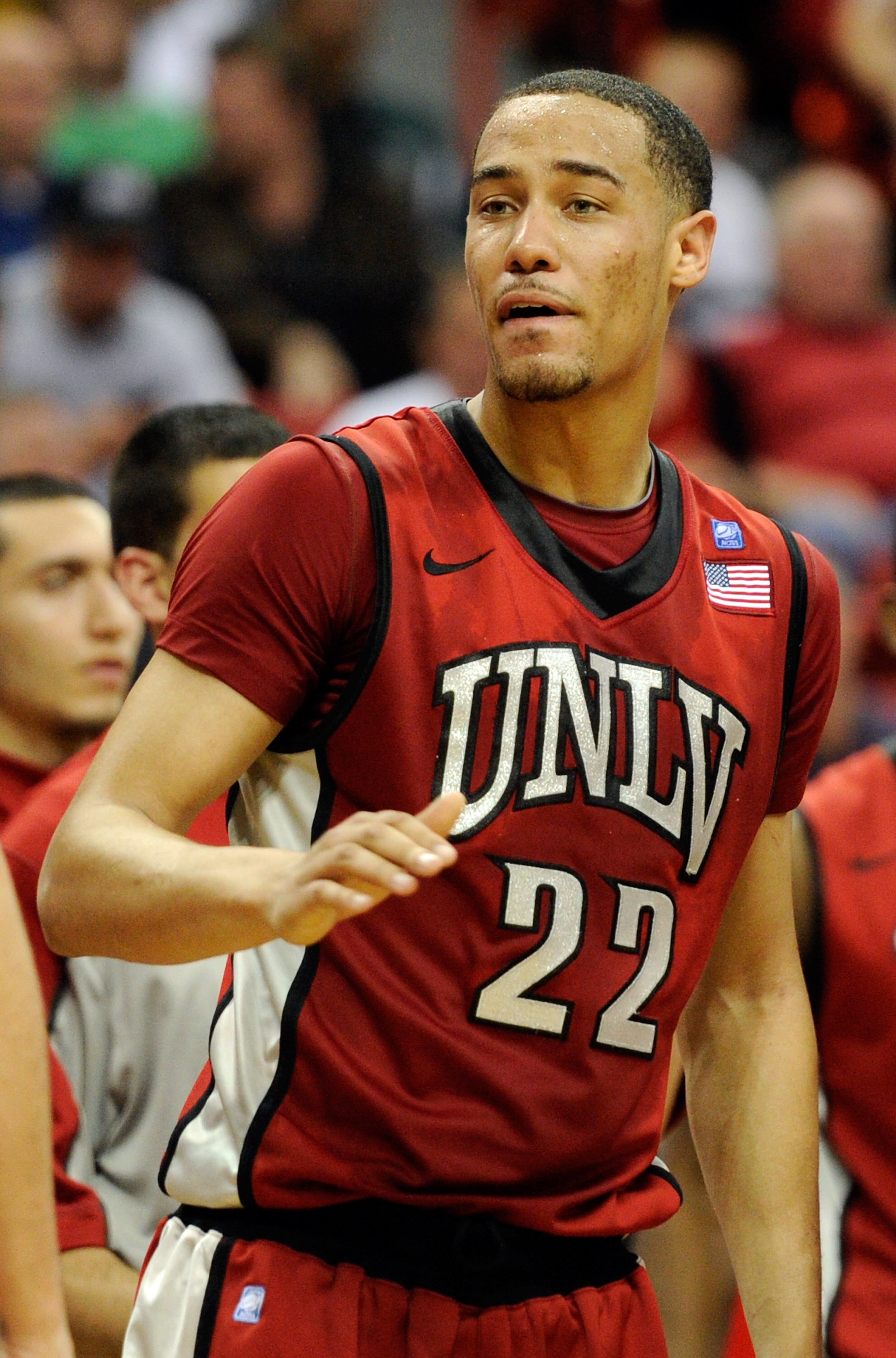 LAS VEGAS, NV - MARCH 11:  Chace Stanback #22 of the UNLV Rebels greets teammates during a timeout in a semifinal game of the Conoco Mountain West Conference Basketball tournament against the San Diego State Aztecs at the Thomas & Mack Center March 11, 20