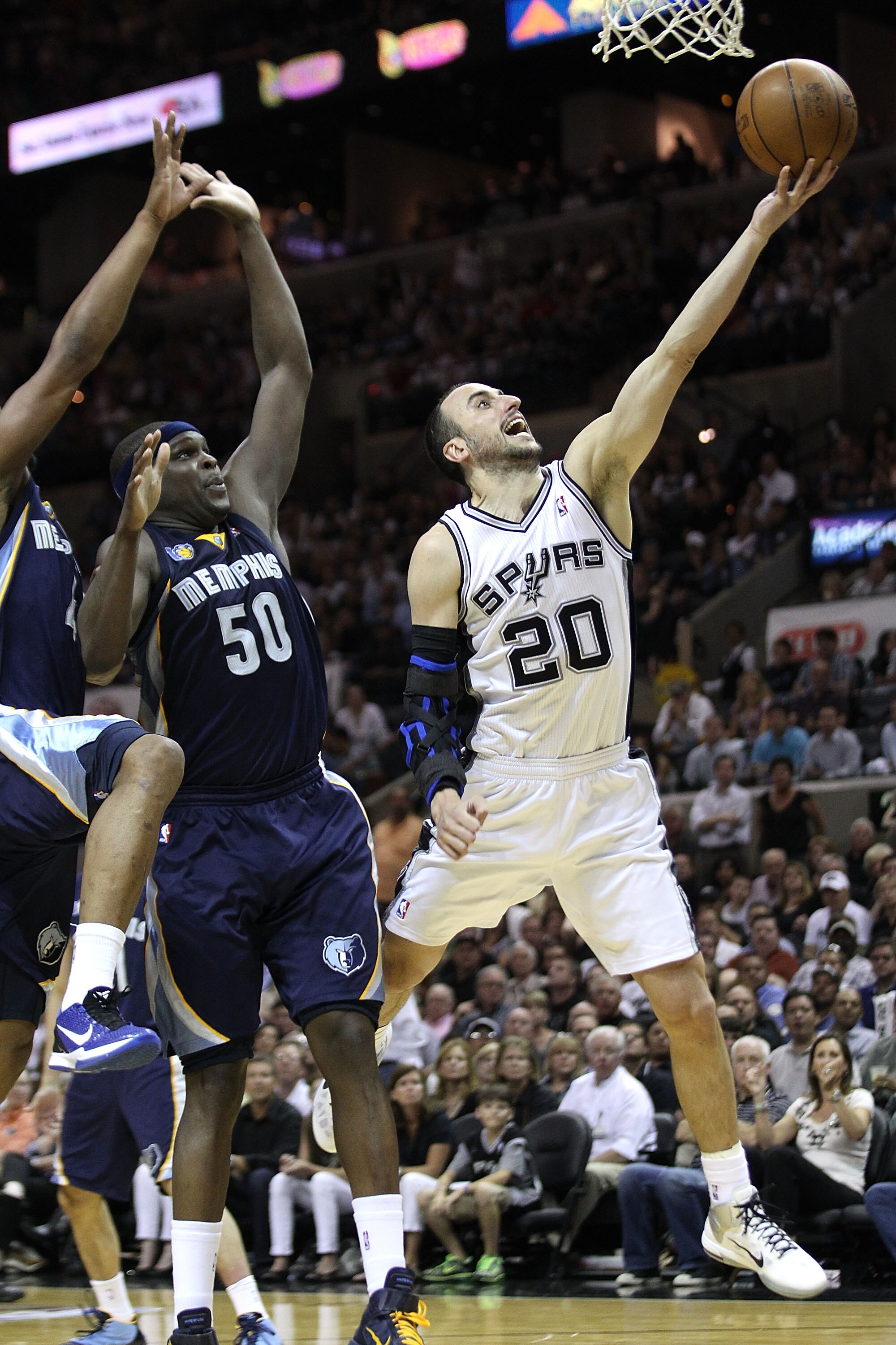 SAN ANTONIO, TX - APRIL 27:  Manu Ginobili #20 of the San Antionio Spurs shoots over Zach Randolph #50 of the Memphis Grizzlies in Game Five of the Western Conference Quarterfinals in the 2011 NBA Playoffs on April 27, 2011 at AT&T Center in San Antonio,