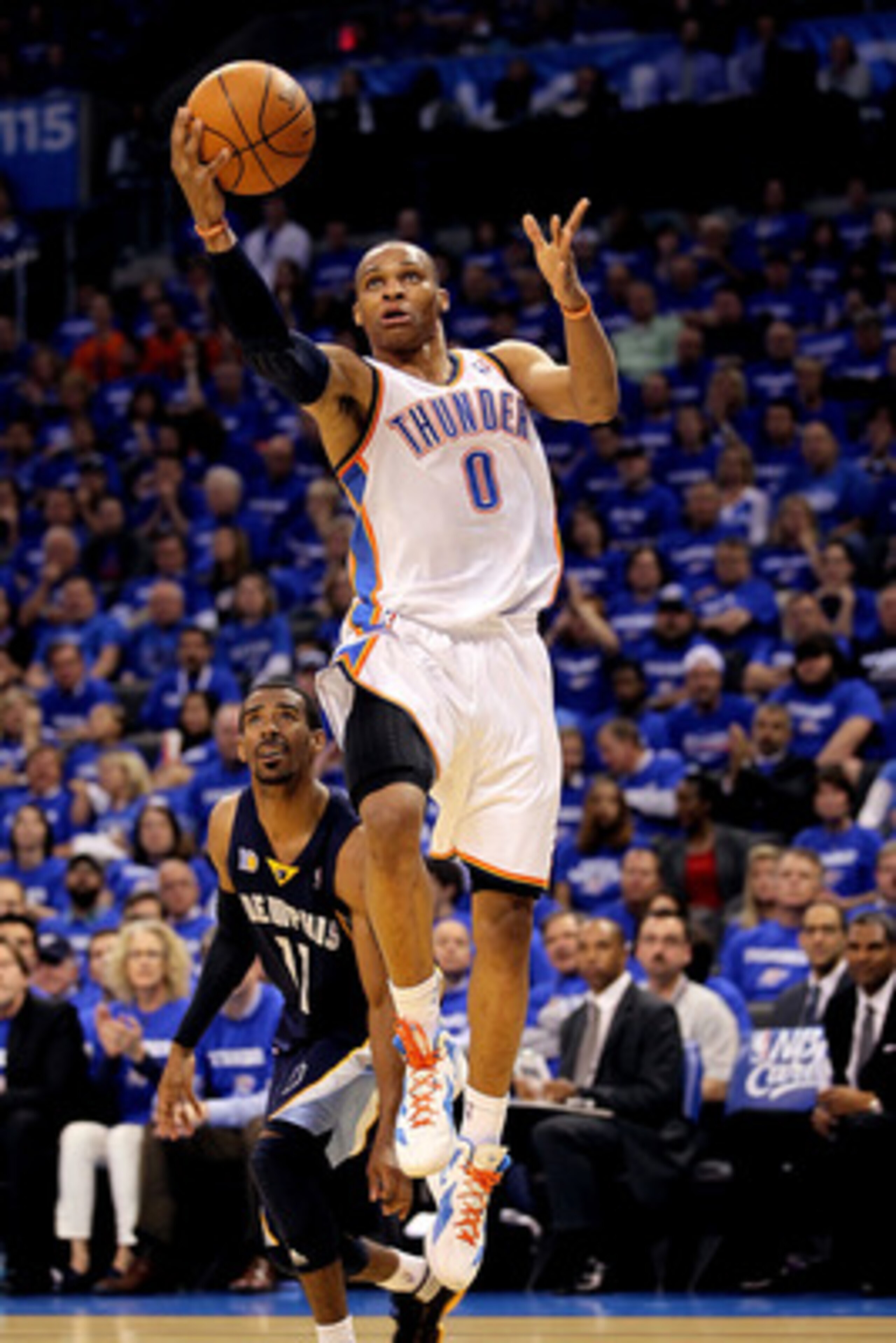 OKLAHOMA CITY, OK - MAY 03:  Guard Russell Westbrook #0 of the Oklahoma City Thunder takes a shot against Mike Conley #11 of the Memphis Grizzlies in Game Two of the Western Conference Semifinals in the 2011 NBA Playoffs on May 3, 2011 at Oklahoma City Ar