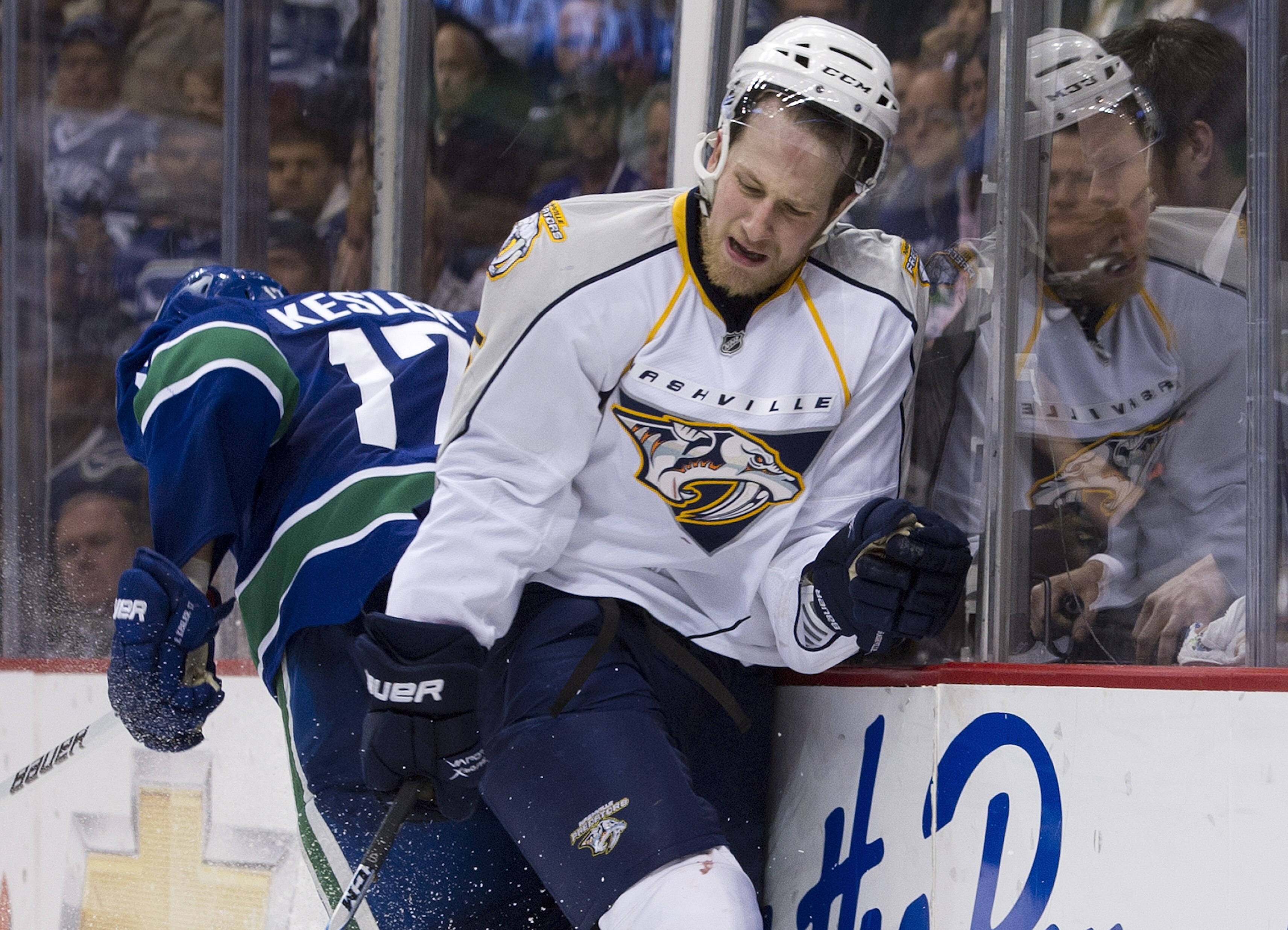 VANCOUVER, CANADA - APRIL 28: Blake Geoffrion #5 of the Nashville Predators reacts after getting hit by Ryan Kesler #17 of the Vancouver Canucks during the third period in Game One of the Western Conference Semifinals during the 2011 NHL Stanley Cup Playo