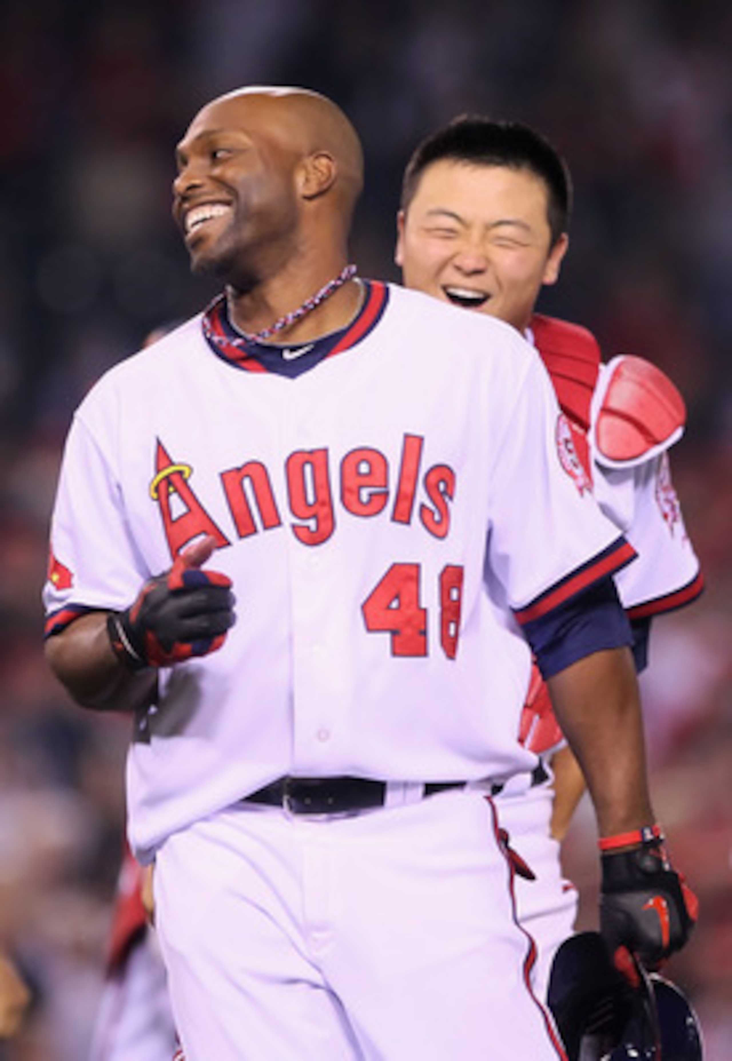 ANAHEIM, CA - MAY 06: Torii Hunter #48 of the Los Angeles Angels of Anaheim is congratulated by Hank Conger #16 after hitting the game wining RBI single against the Cleveland Indians in the 11th inning at Angel Stadium of Anaheim on May 6, 2011 in Anahei ANAHEIM, CA - MAY 06: Torii Hunter #48 of the Los Angeles Angels of Anaheim is congratulated by Hank Conger #16 after hitting the game wining RBI single against the Cleveland Indians in the 11th inning at Angel Stadium of Anaheim on May 6, 2011 in Anahei
