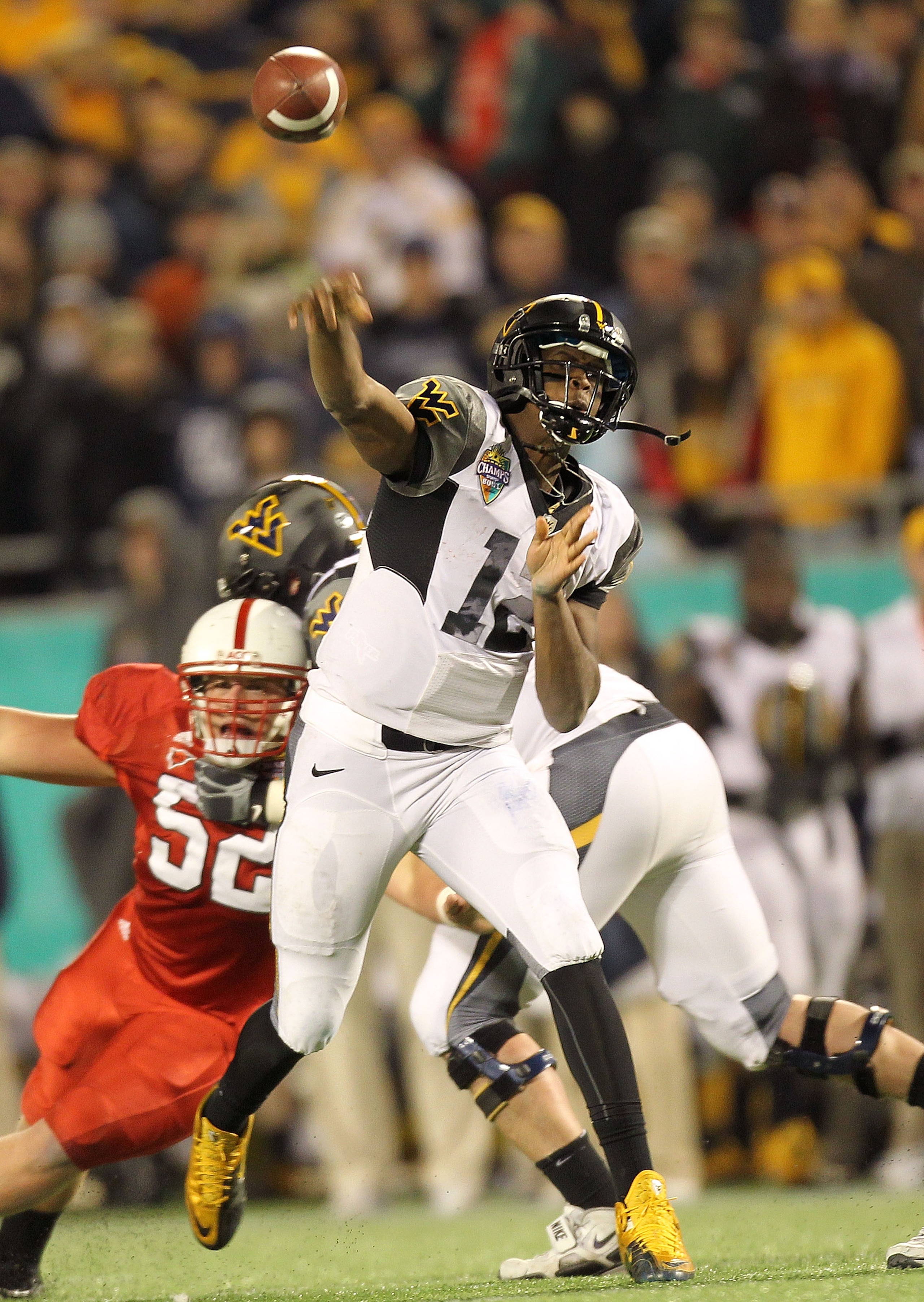 ORLANDO, FL - DECEMBER 28: Geno Smith #12 of the West Virginia Mountineers passes the ball during the Champs Sports Bowl against the North Carolina State Wolfpack at Florida Citrus Bowl Stadium on December 28, 2010 in Orlando, Florida. (Photo by Mike Eh ORLANDO, FL - DECEMBER 28: Geno Smith #12 of the West Virginia Mountineers passes the ball during the Champs Sports Bowl against the North Carolina State Wolfpack at Florida Citrus Bowl Stadium on December 28, 2010 in Orlando, Florida. (Photo by Mike Eh