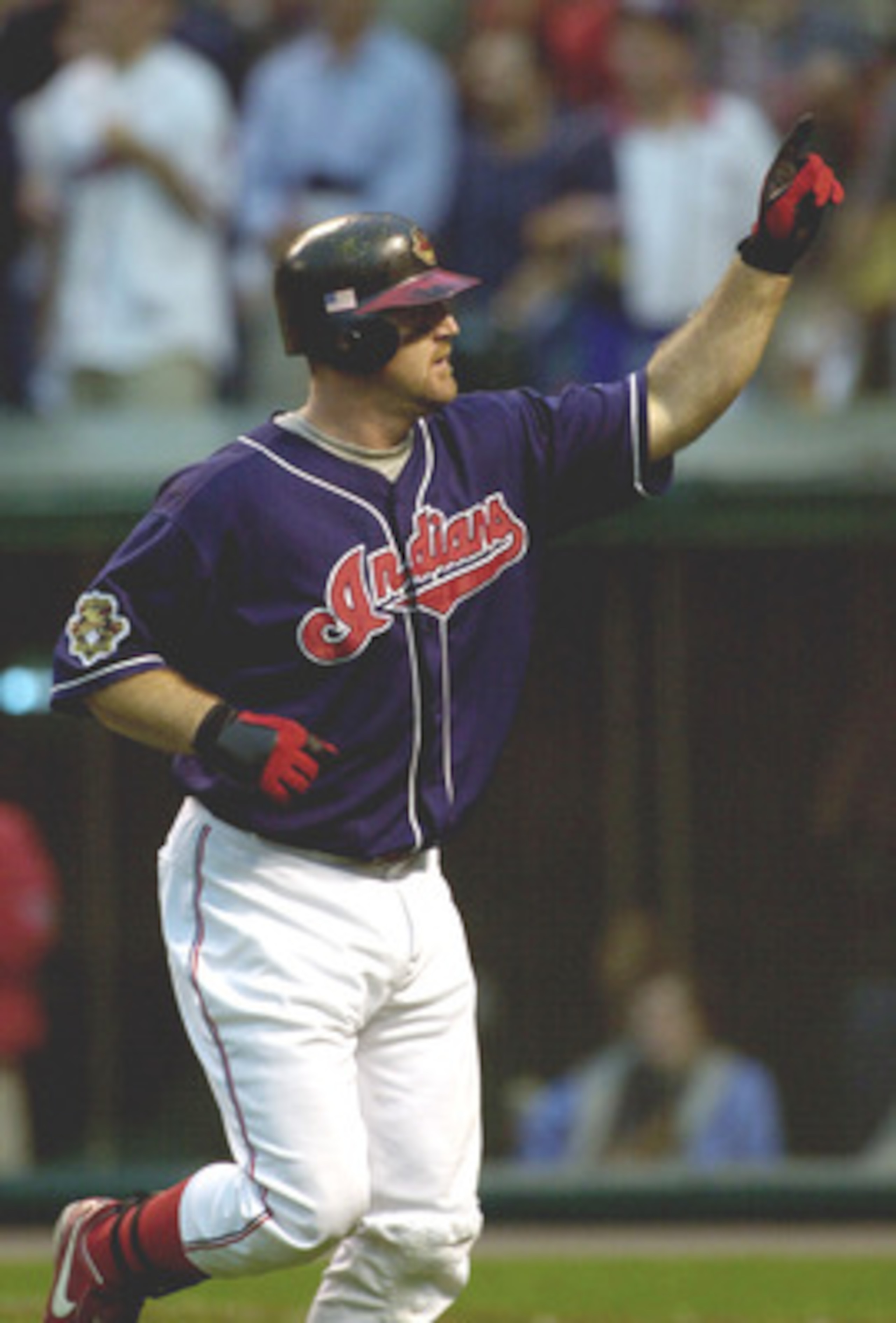 13 Oct 2001: Jim Thome #25 of the Cleveland Indians acknowledges the crowd as he heads to the dugout after hitting a homne run in the sixth inning against the Seattle Mariners during game three of the American League Division Series at Jacobs Field in Cl 13 Oct 2001: Jim Thome #25 of the Cleveland Indians acknowledges the crowd as he heads to the dugout after hitting a homne run in the sixth inning against the Seattle Mariners during game three of the American League Division Series at Jacobs Field in Cl