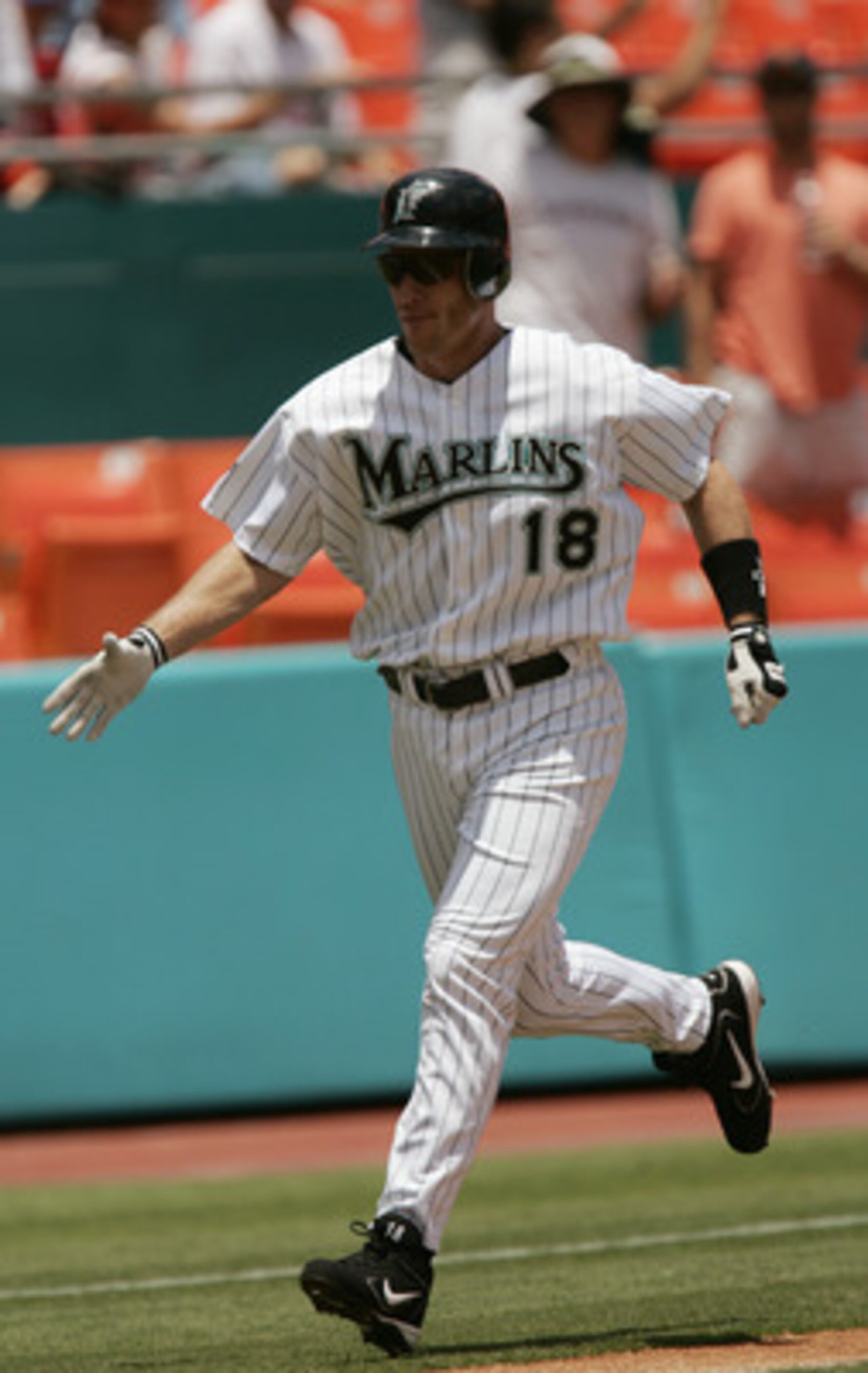 MIAMI - JULY 29: Left fielder Jeff Conine #18 of the Florida Marlins celebrates his homerun in the second inning against the Philadelphia Phillies on July 29, 2004 at Pro Player Stadium in Miami, Florida. The Marlins defeated the Phillies 10-1. (Photo b MIAMI - JULY 29: Left fielder Jeff Conine #18 of the Florida Marlins celebrates his homerun in the second inning against the Philadelphia Phillies on July 29, 2004 at Pro Player Stadium in Miami, Florida. The Marlins defeated the Phillies 10-1. (Photo b