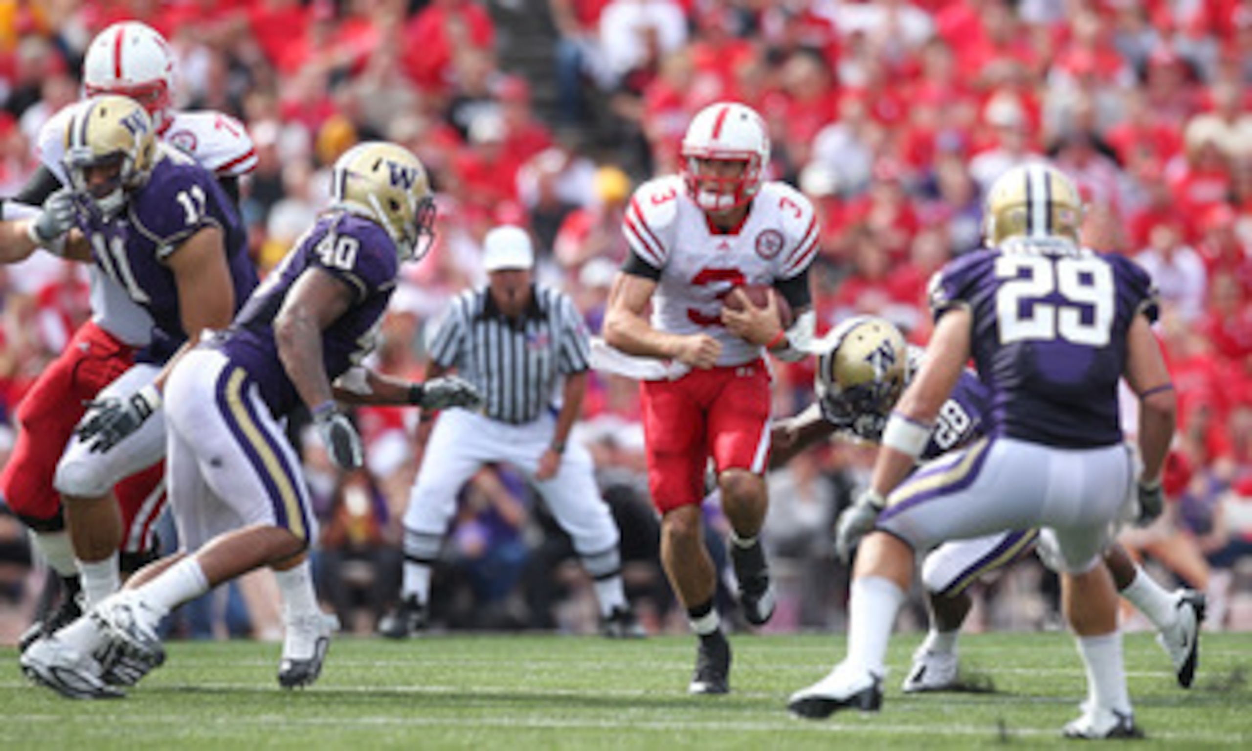 SEATTLE - SEPTEMBER 18: Quarterback Taylor Martinez #3 of the Nebraska Cornhuskers rushes against the Washington Huskies on September 18, 2010 at Husky Stadium in Seattle, Washington. (Photo by Otto Greule Jr/Getty Images)