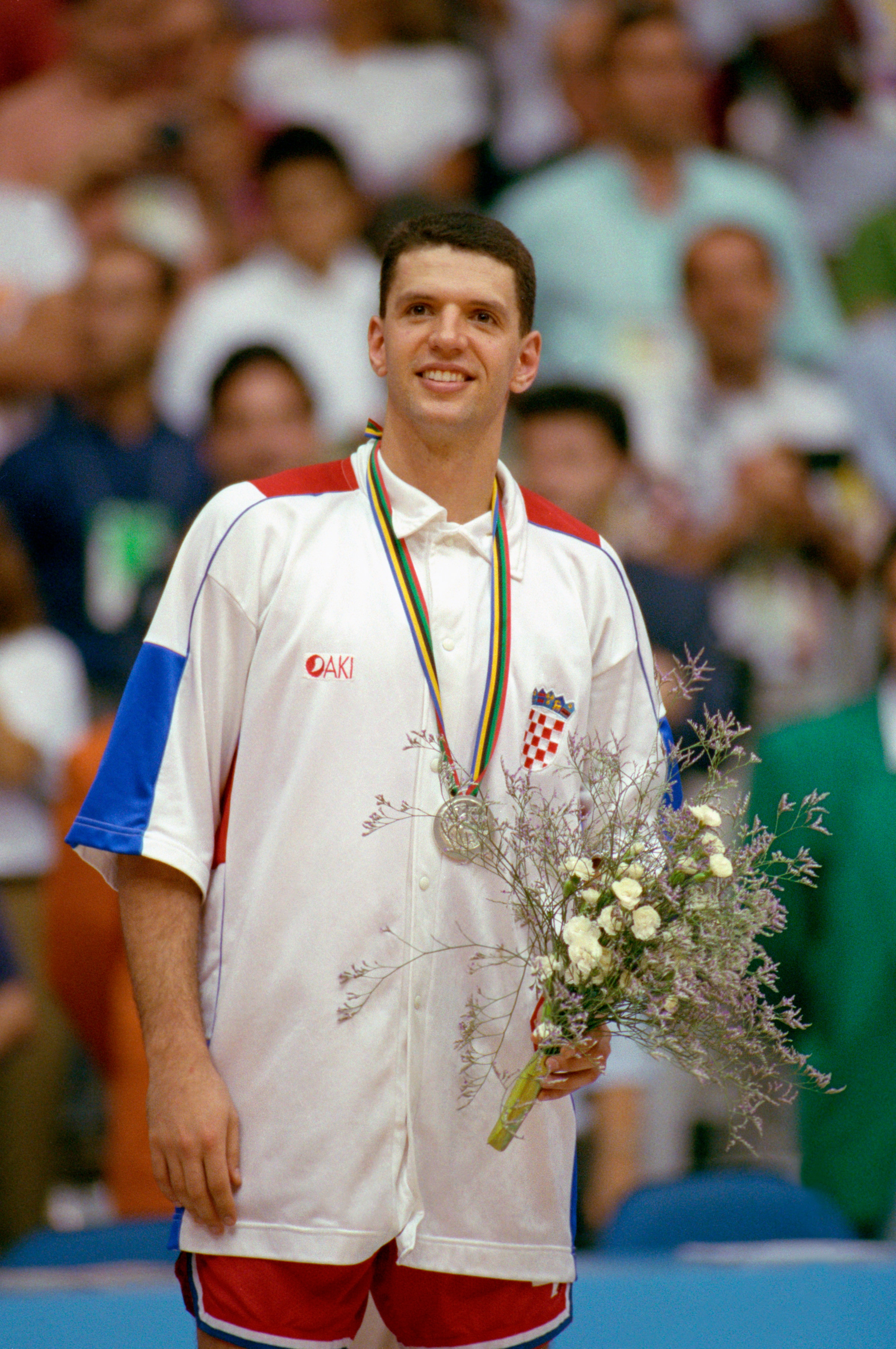BARCELONA, SPAIN - AUGUST 8:  Drazen Petrovic #4 of Croatia is awarded with the silver medal after the game against the United States in the 1992 Olympic games on August 8, 1992 in Barcelona, Spain. The 'Dream Team' defeated Croatia 103-70. NOTE TO USER: