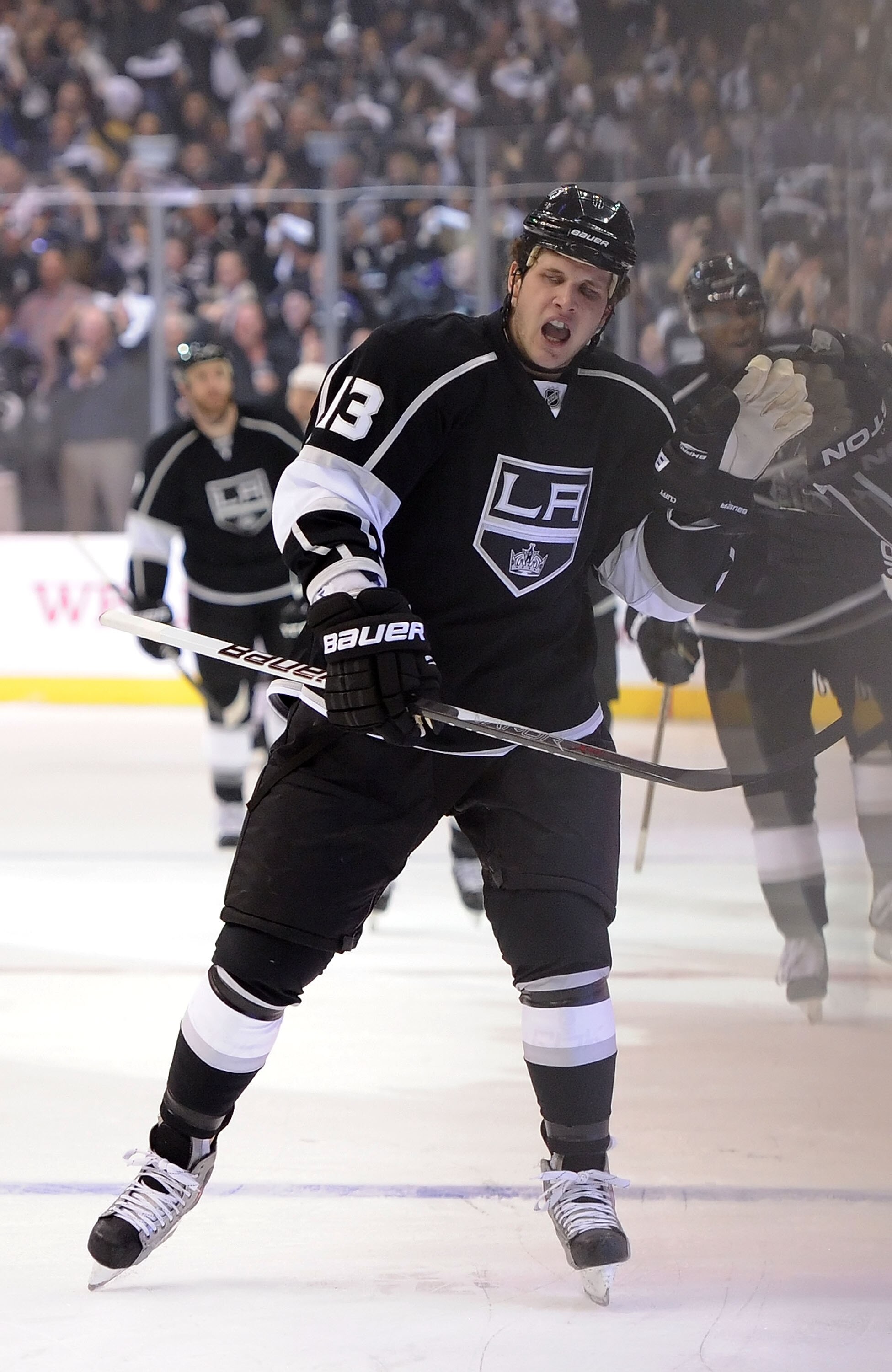 LOS ANGELES, CA - APRIL 19:  Kyle Clifford #13 of the Los Angeles Kings celebrates after a goal in the first period of game three of the Western Conference Quarterfinals against the San Jose Sharks during the 2011 NHL Stanley Cup Playoffs at Staples Cente