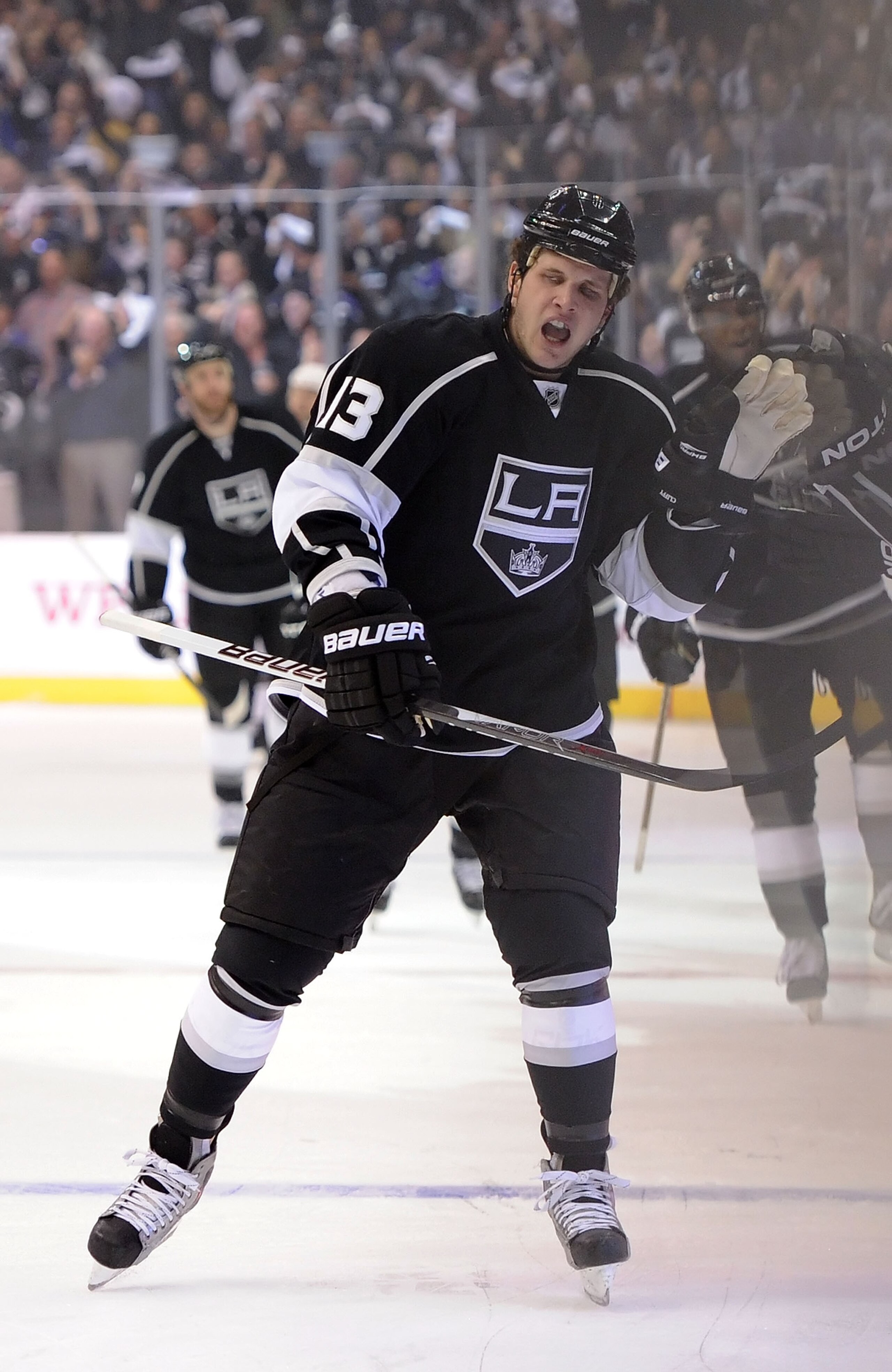 LOS ANGELES, CA - APRIL 19:  Kyle Clifford #13 of the Los Angeles Kings celebrates after a goal in the first period of game three of the Western Conference Quarterfinals against the San Jose Sharks during the 2011 NHL Stanley Cup Playoffs at Staples Cente