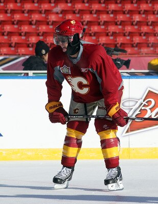 CALGARY, AB - FEBRUARY 19:  Mikael Backlund #11 of the Calgary Flames copes with the weather during the practice session the day before the 2011 NHL Heritage Classic at McMahon Stadium on February 19, 2011 in Calgary, Canada.  (Photo by Andre Ringuette/Ge