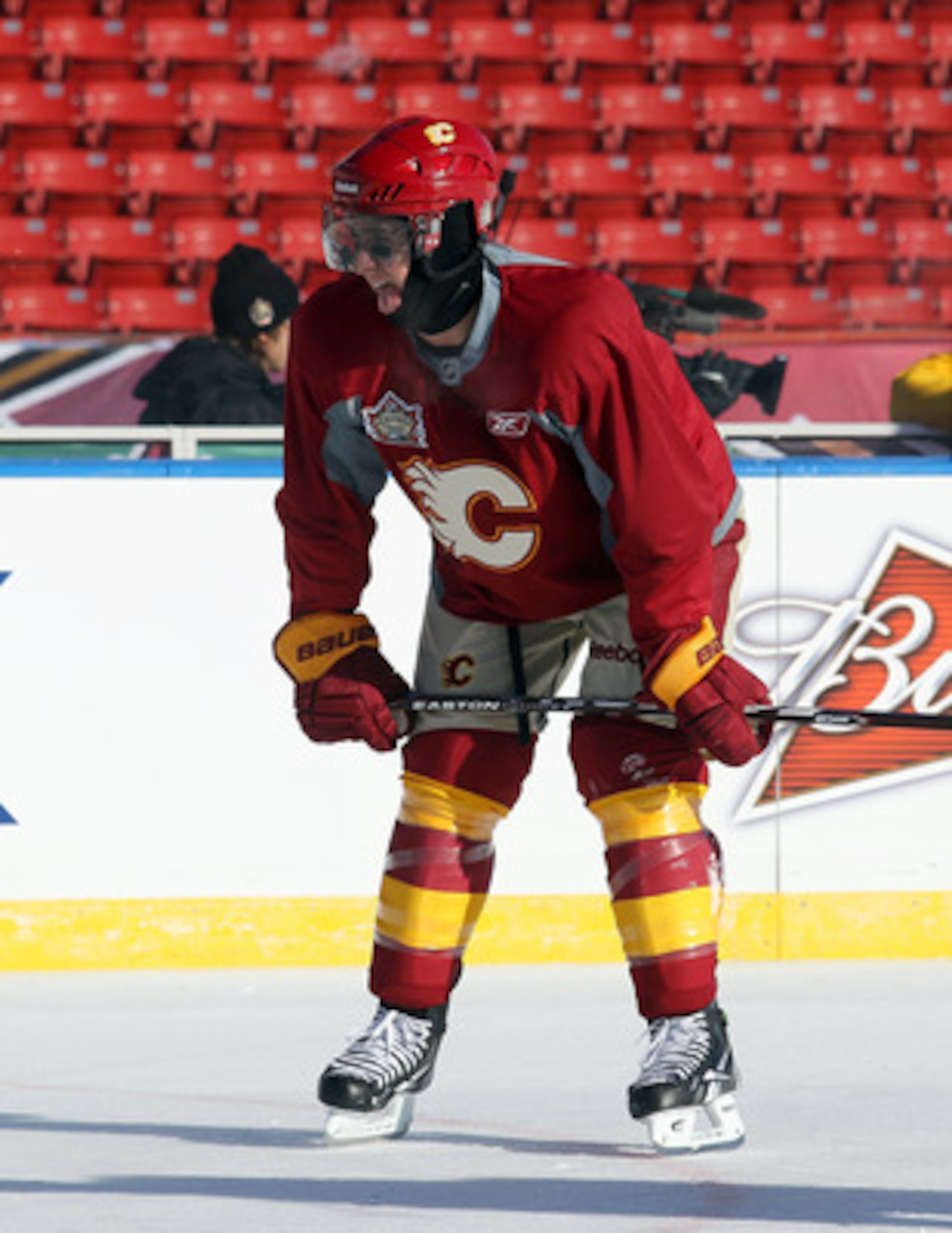 CALGARY, AB - FEBRUARY 19:  Mikael Backlund #11 of the Calgary Flames copes with the weather during the practice session the day before the 2011 NHL Heritage Classic at McMahon Stadium on February 19, 2011 in Calgary, Canada.  (Photo by Andre Ringuette/Ge
